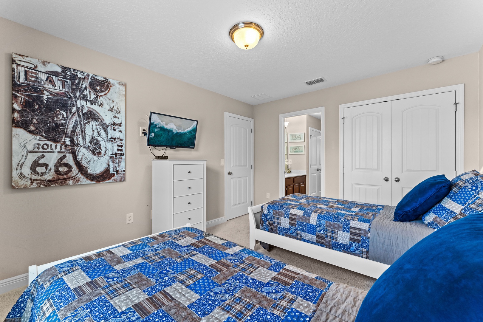 Bedroom 2 with 2 twin beds, Smart TV, and Jack & Jill style ensuite
