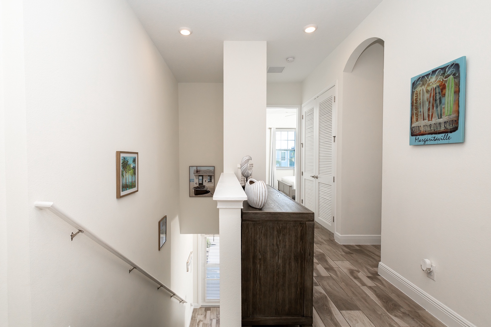 The airy 2nd floor hallway offers plenty of space & light