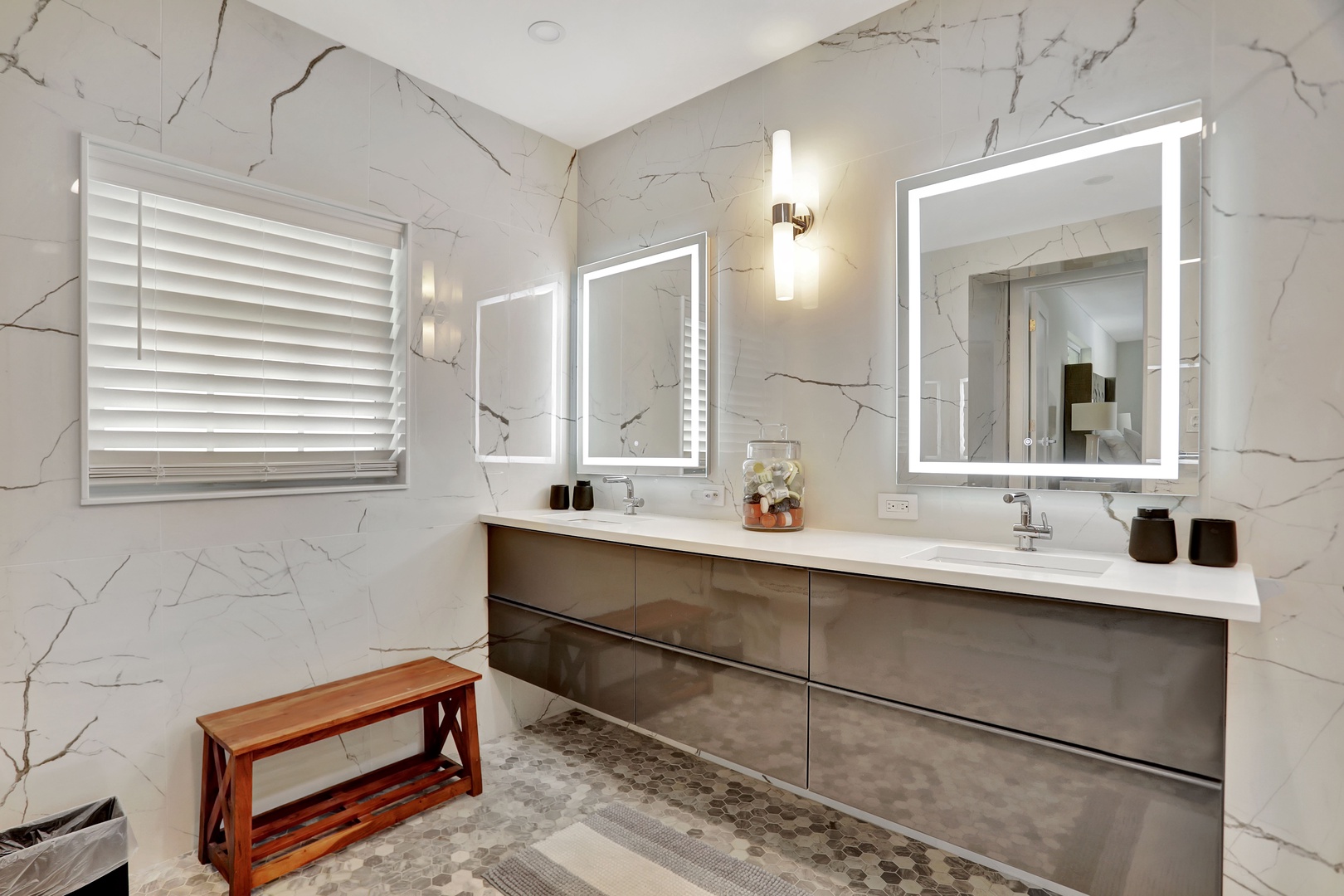 High-end finishes await in this spacious ensuite, offering a luxe glass shower