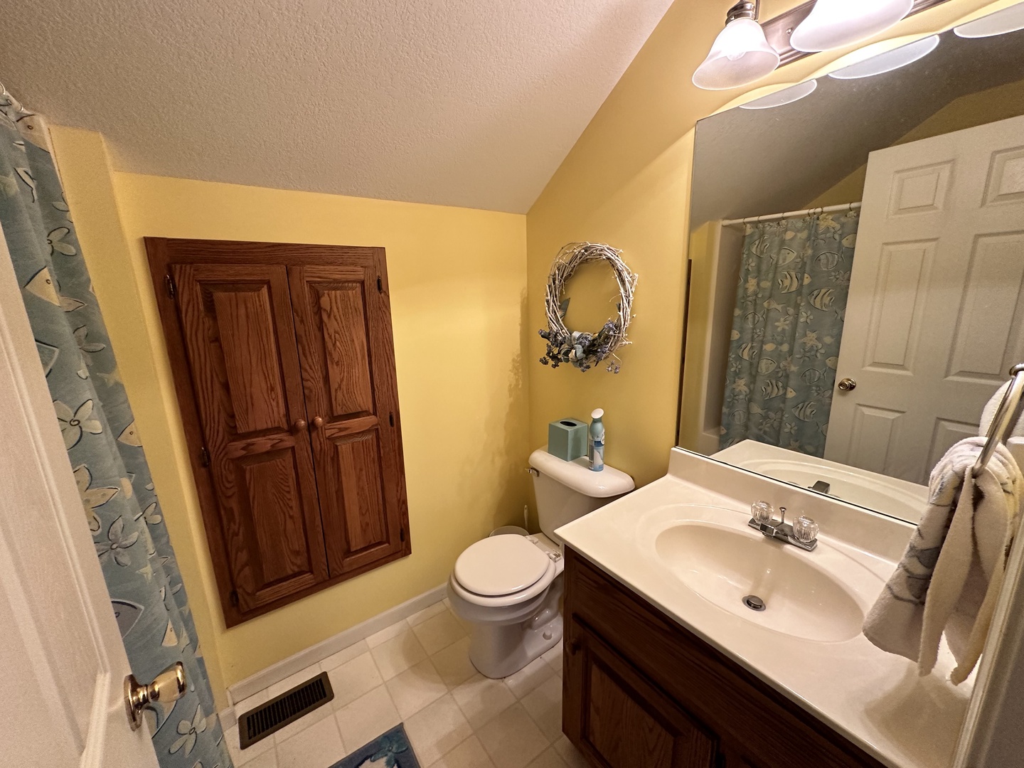 Shared bathroom with shower/tub combo