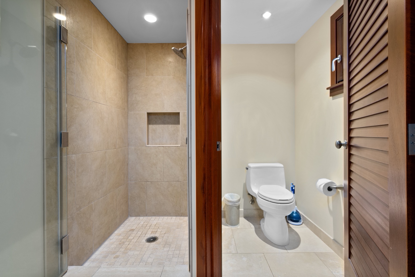 Primary bedroom's ensuite features a separate shower and toilet space