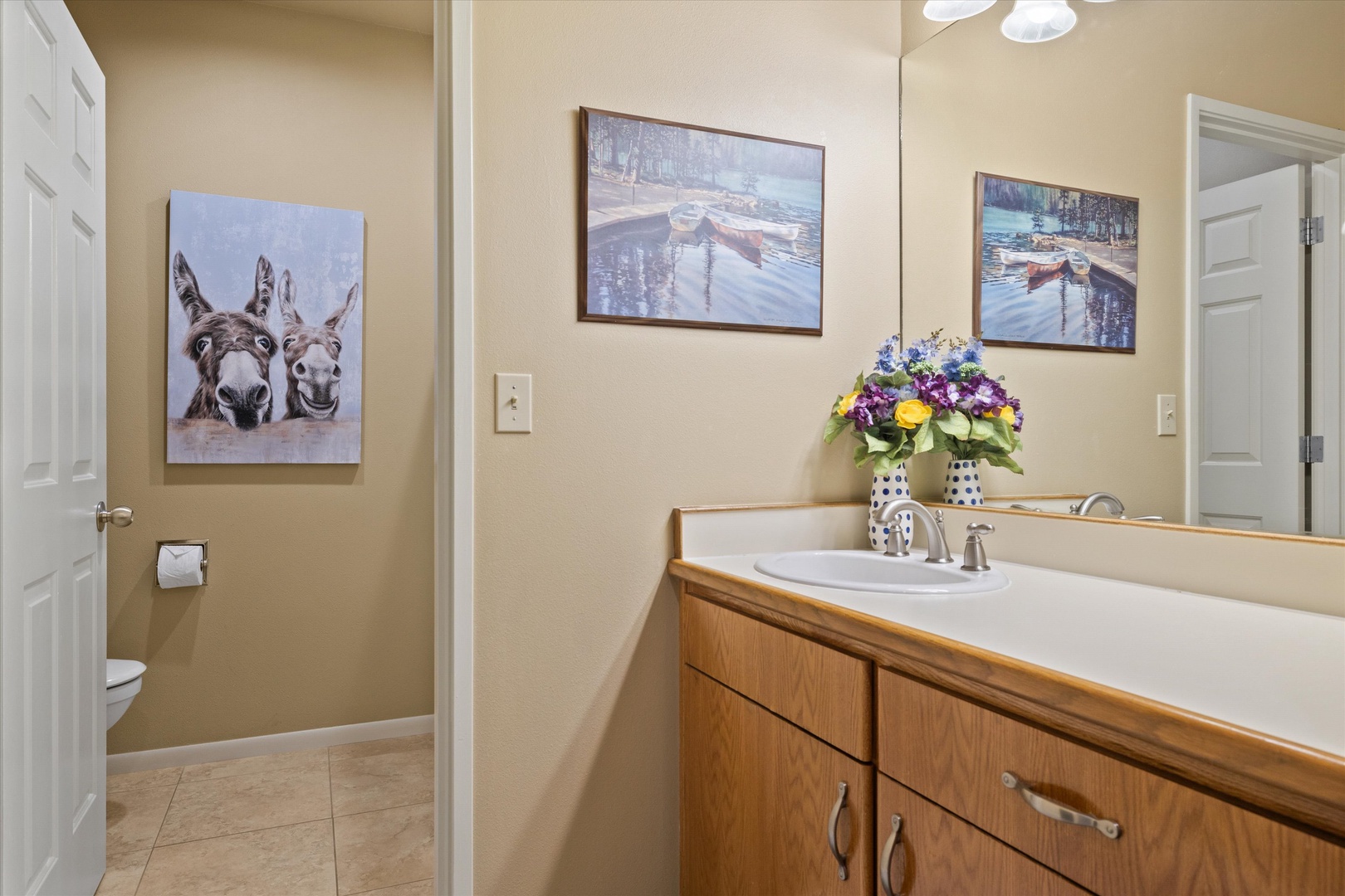 The full bathroom features an oversized single vanity & shower/tub combo