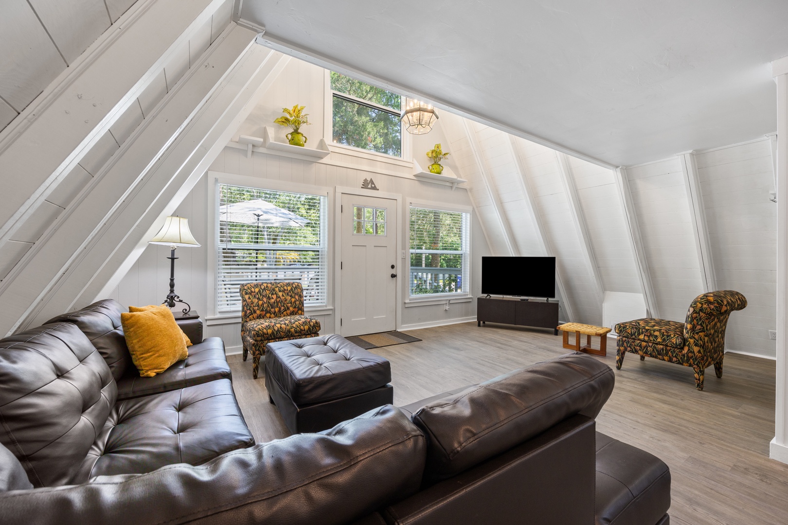 Bright living area with Smart TV, and leather seating