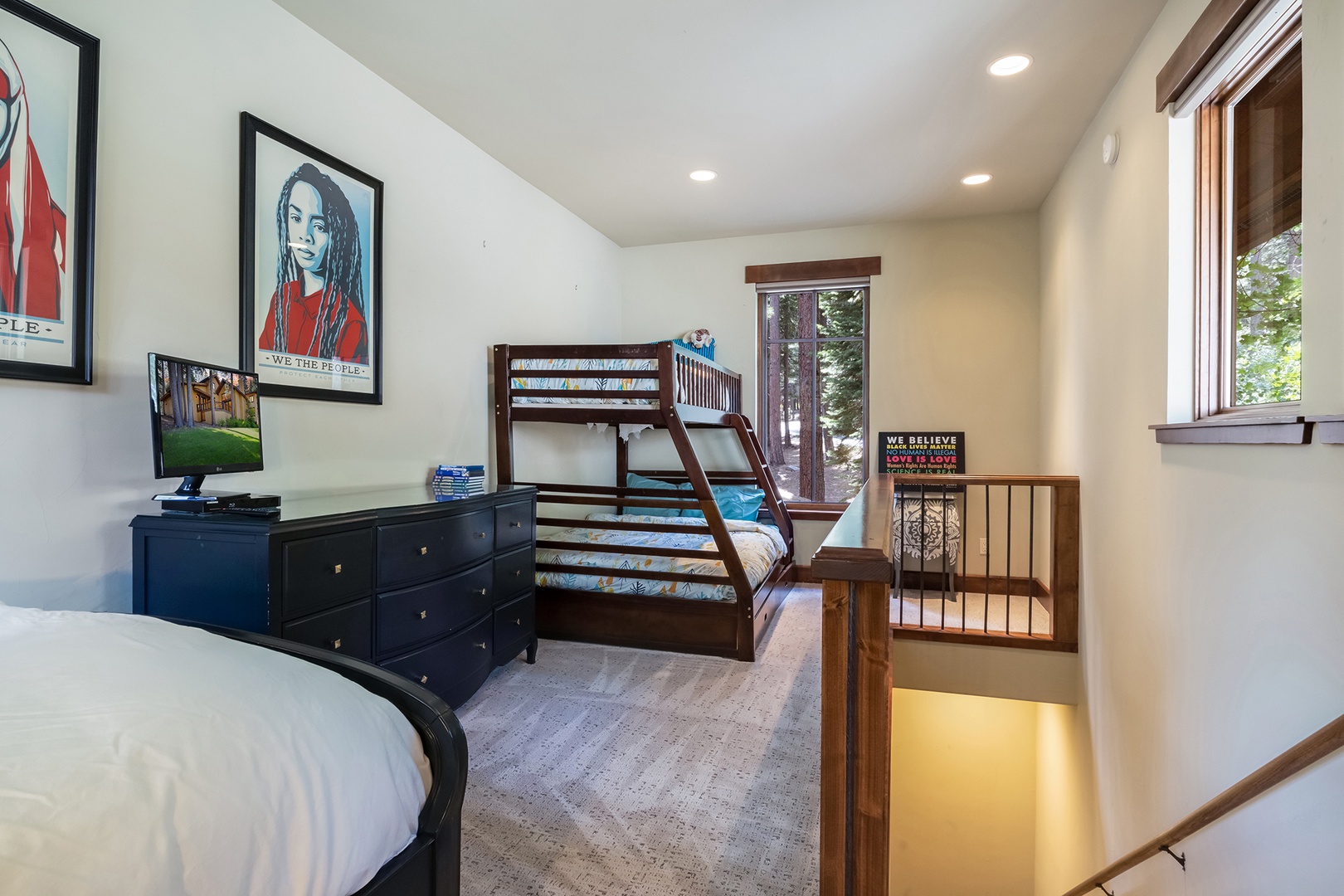 Bedroom 1 loft with twin bed, twin/full bunk bed, and TV