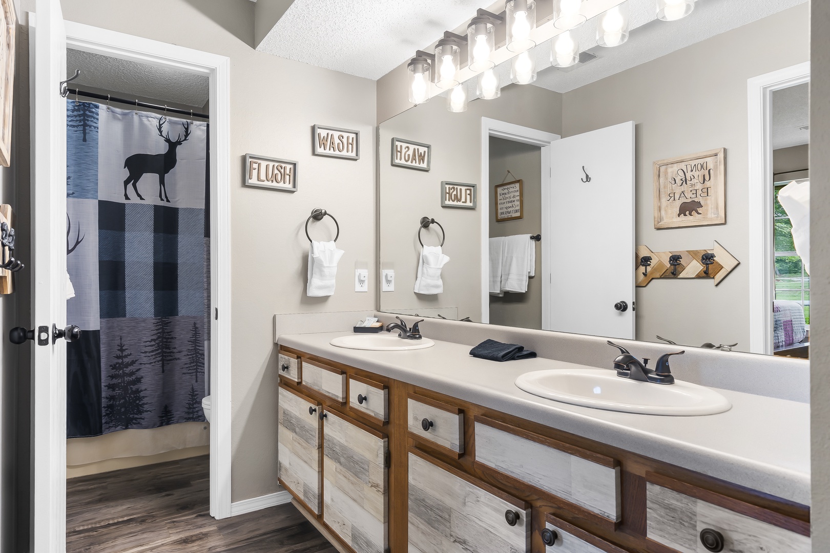 A double vanity & shower/tub combo awaits in the full ensuite