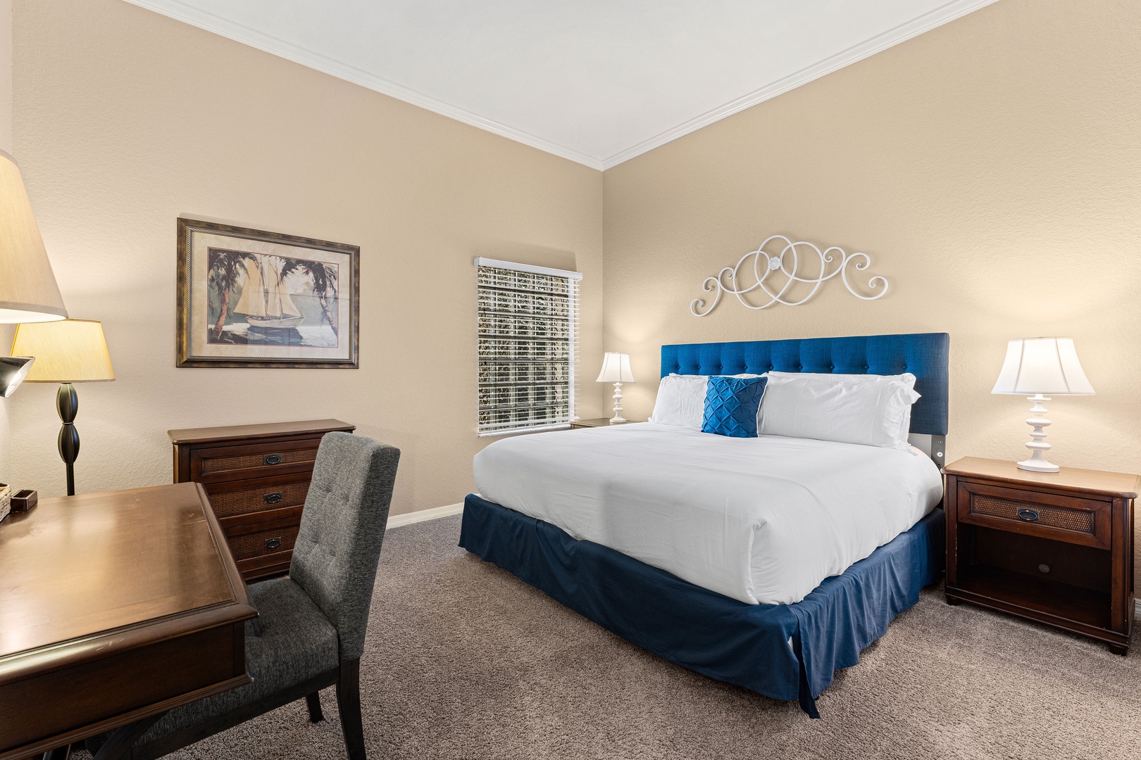 The final bedroom retreat features a regal king bed & desk workspace