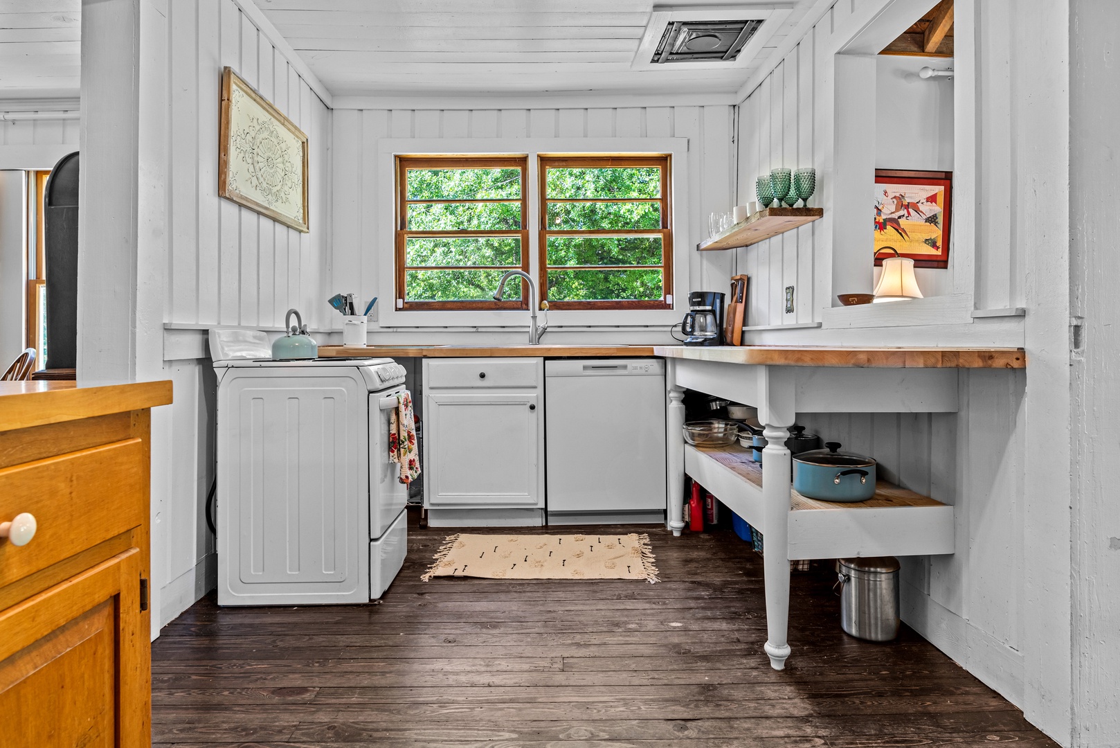 The country kitchen offers ample space & all the comforts of home