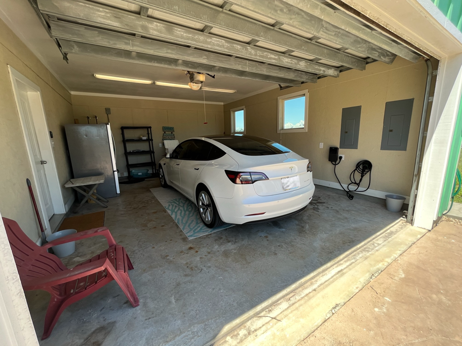 Enjoy the convenience of an in-house EV Charger – please note the Tesla pictured is not included!