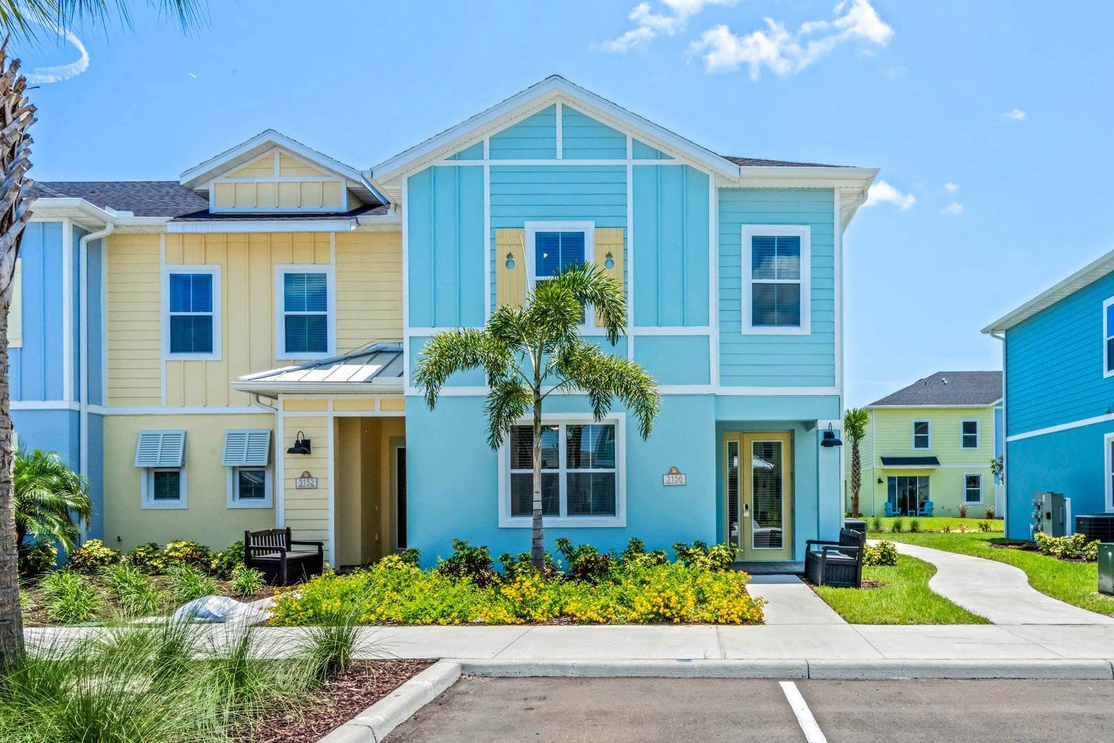 Welcome to the bright and cheerful blue exterior of this end unit townhome!