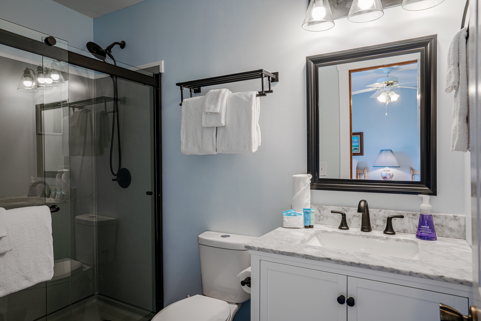 The second bedroom ensuite contains a single vanity & glass shower