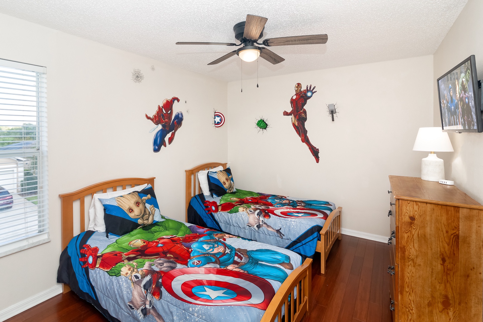 Two Twin beds in the Spider-Man and Iron Man themed room