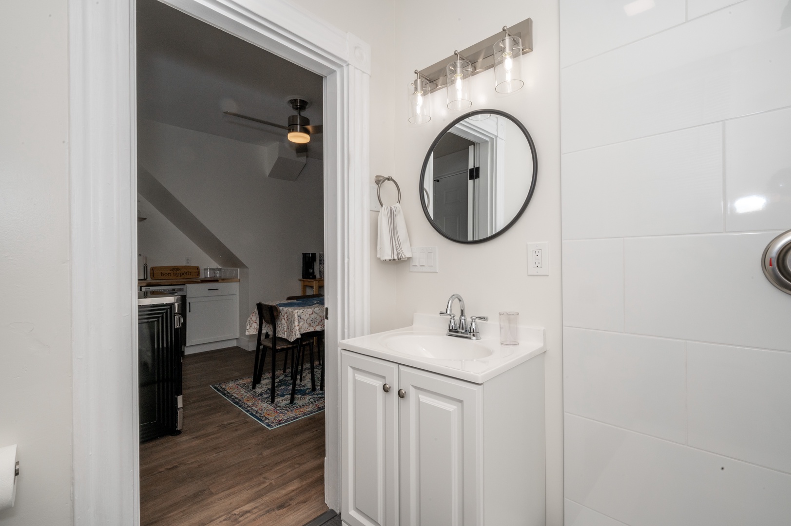 Apartment A’s full bath includes a single vanity & shower