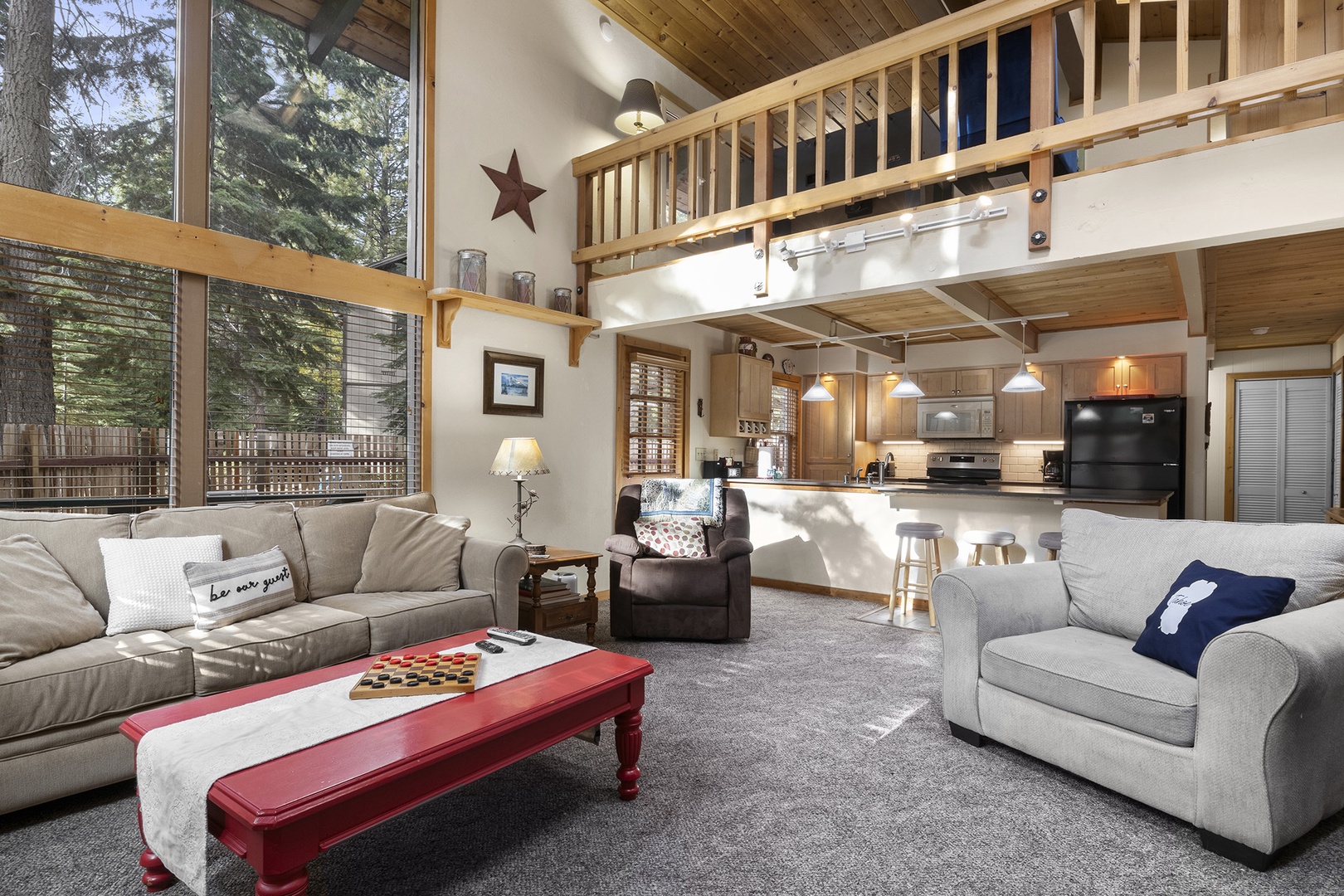 Living room with floor to ceiling windows, gas fireplace, RokuTV