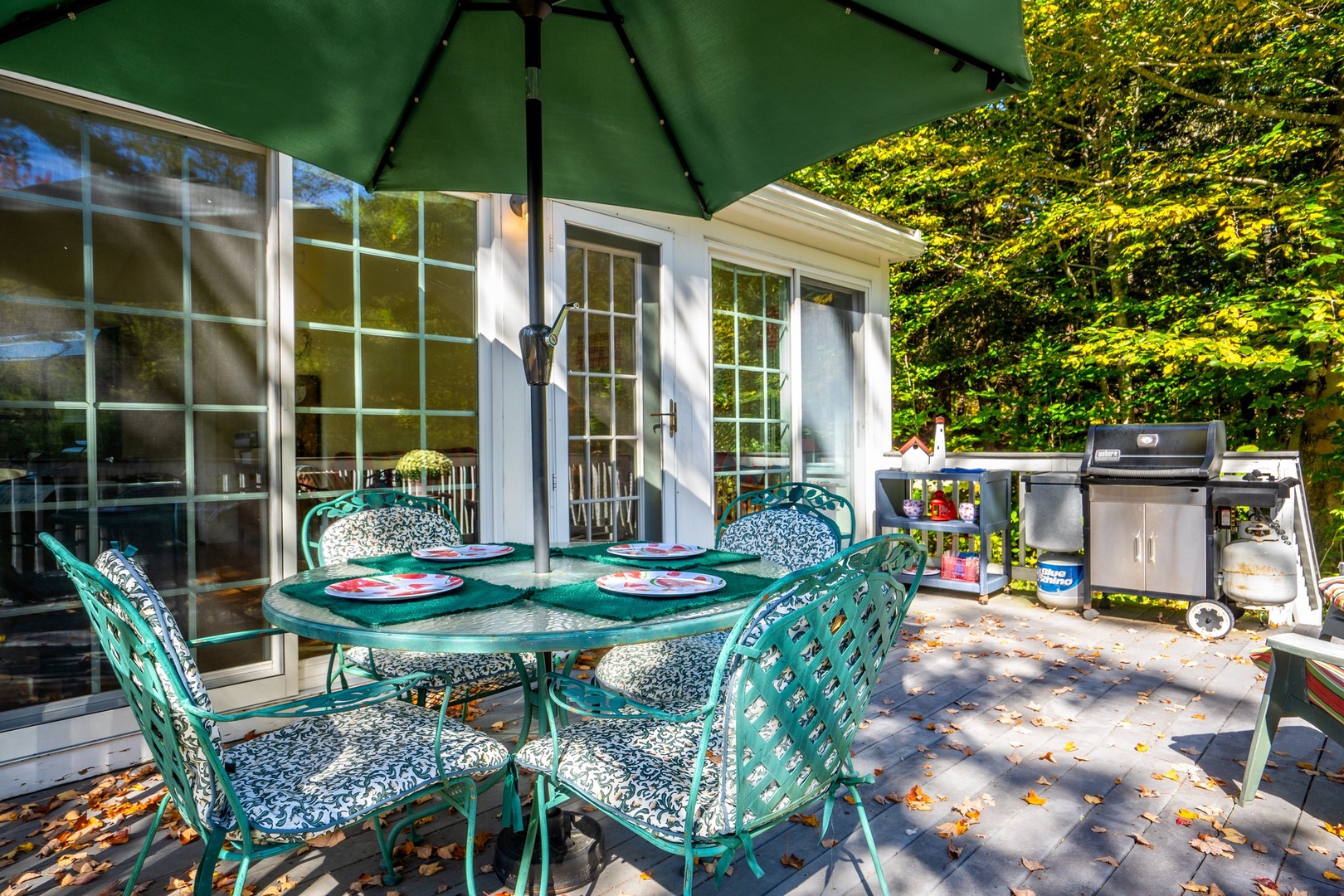 Spacious deck with outdoor seating and grill