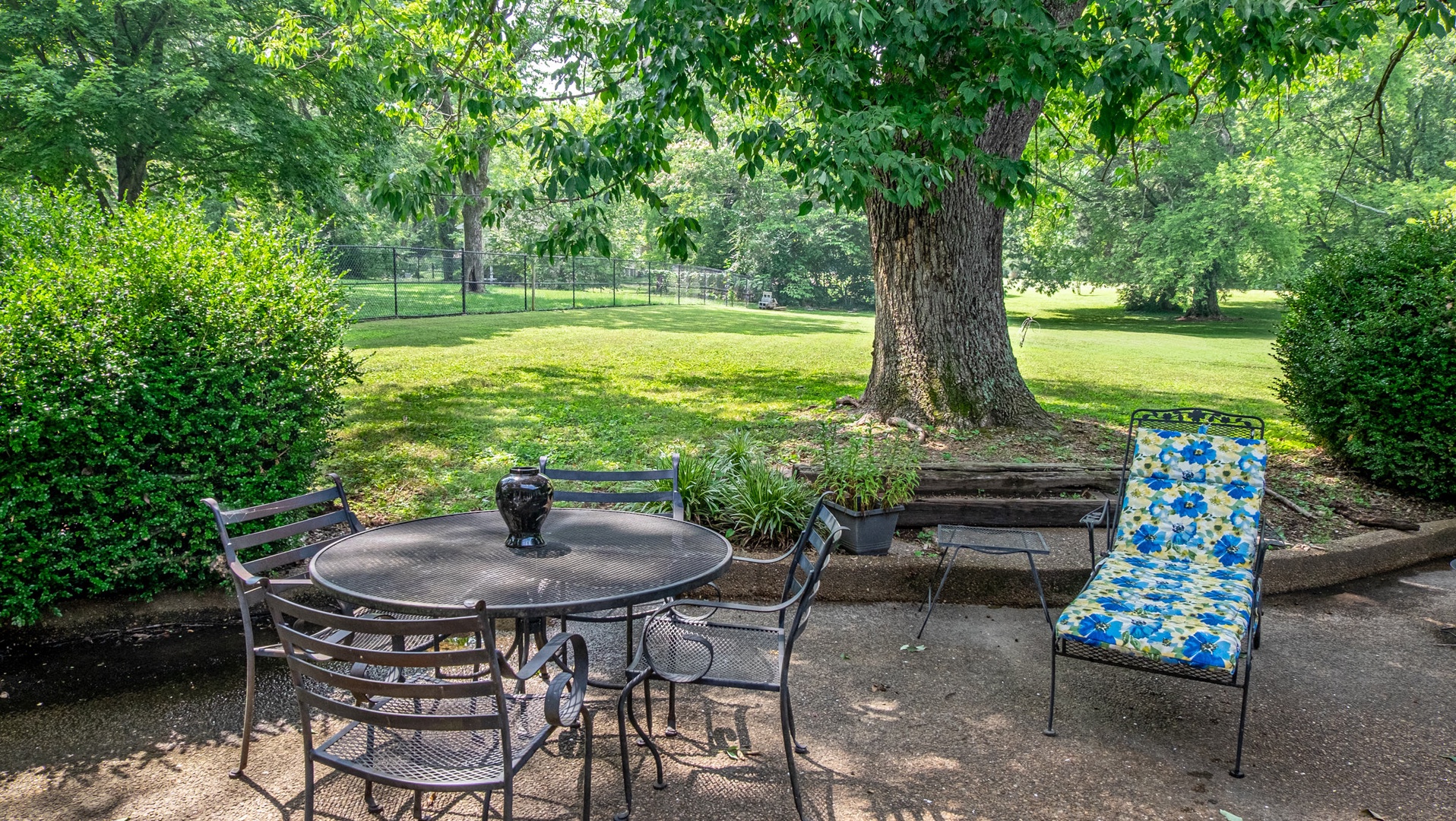 Expansive patio with seating on the acre land
