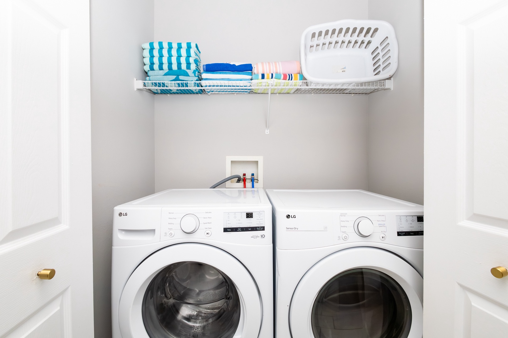 Private laundry is available for your stay, tucked away in closet of kitchen