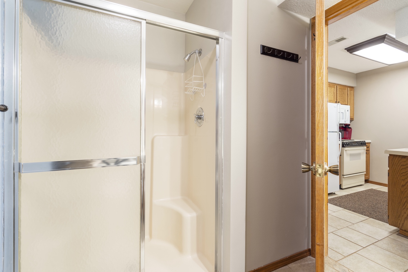 The shared full bath features a single vanity & shower