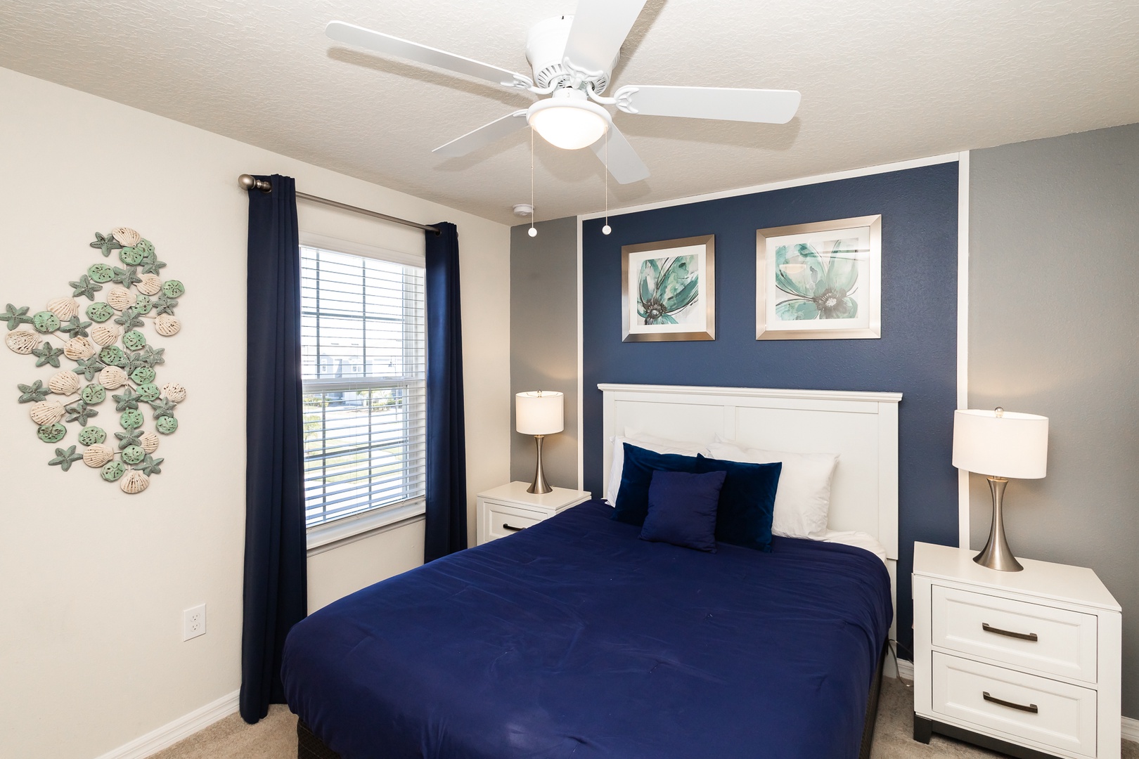 This 2nd floor queen suite offers a private en suite, Smart TV, & ceiling fan