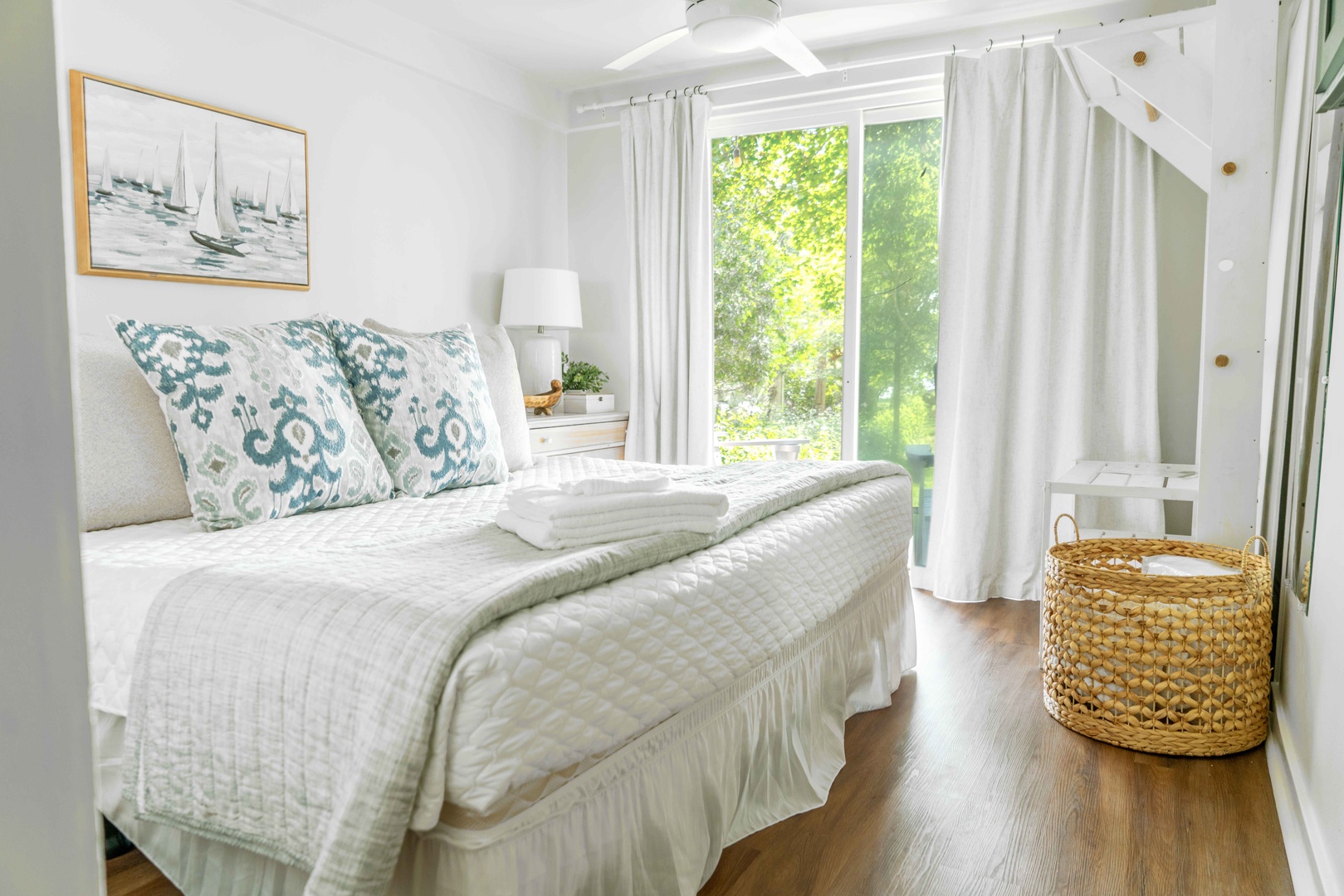 This bright, cheerful king bedroom boasts access to the serene deck