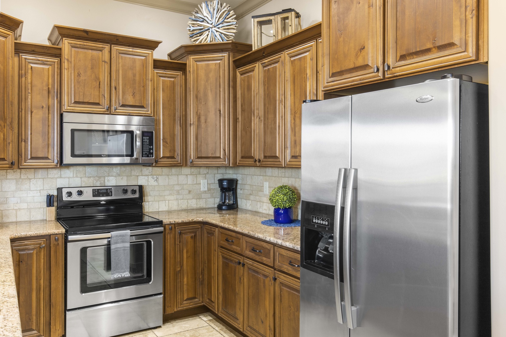 The open, updated kitchen is spacious & offers all the comforts of home