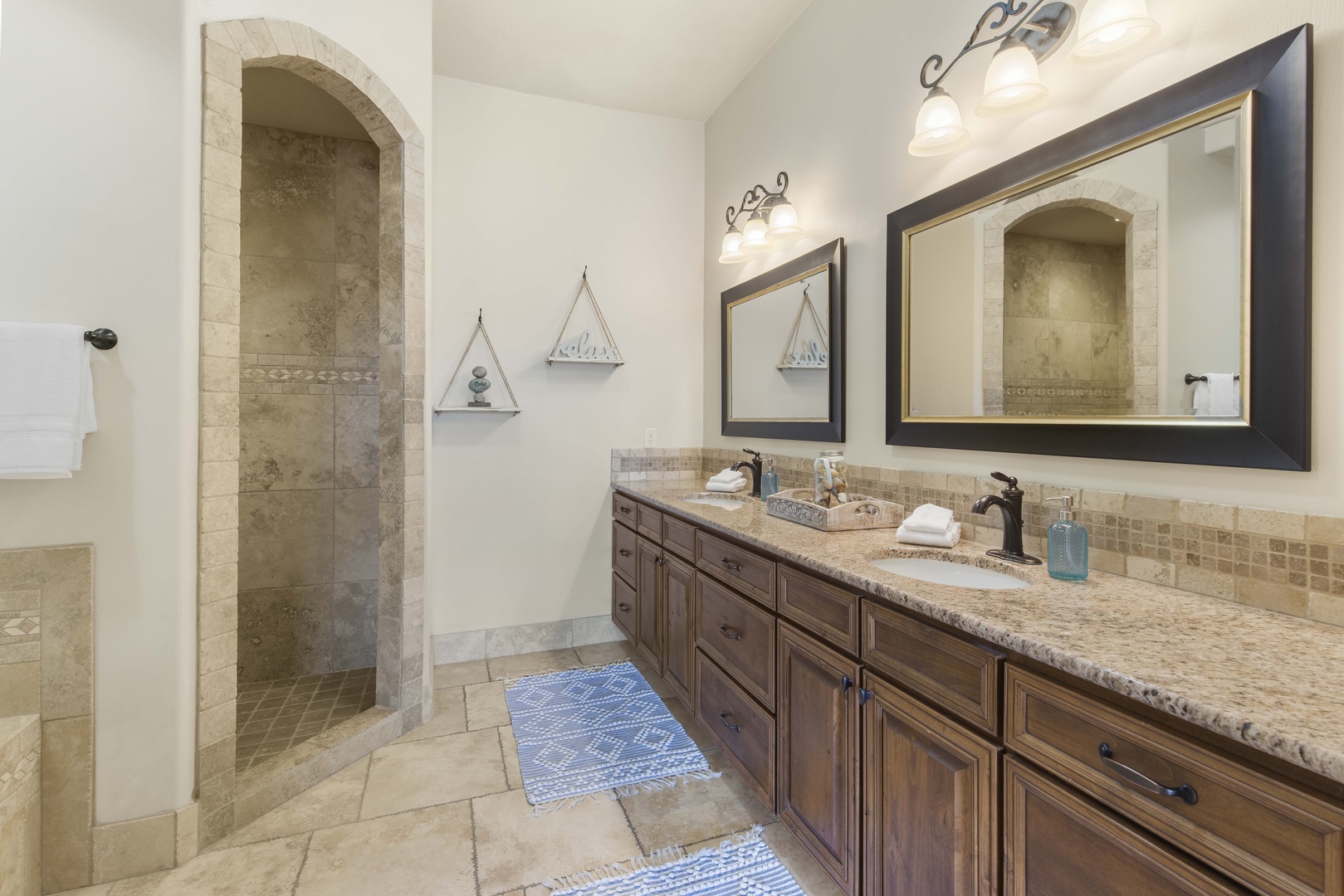 The king en suite bath boasts a double vanity, shower, & Jacuzzi soaking tub