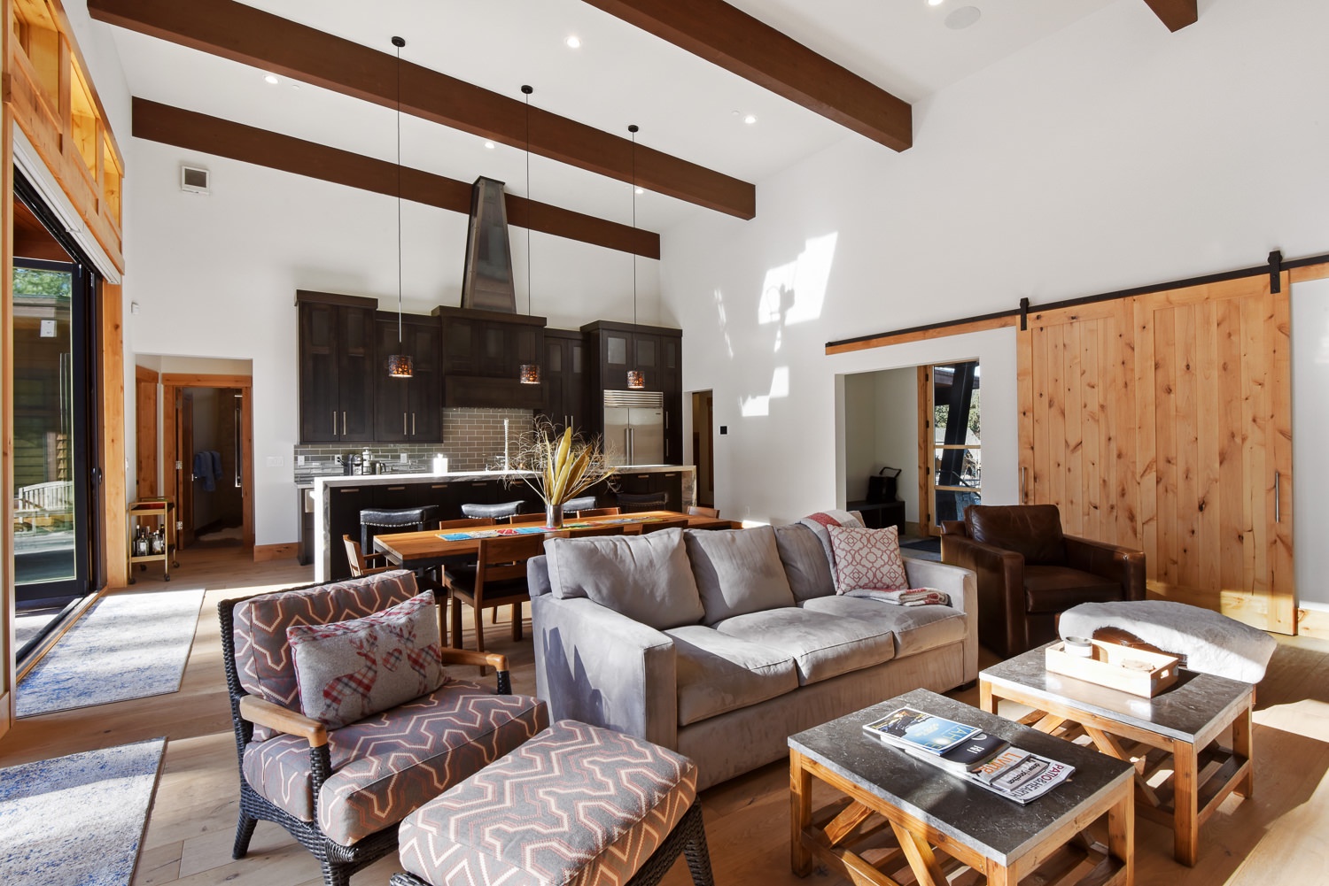 Main open living space with fireplace, Smart TV, and open access to the patio