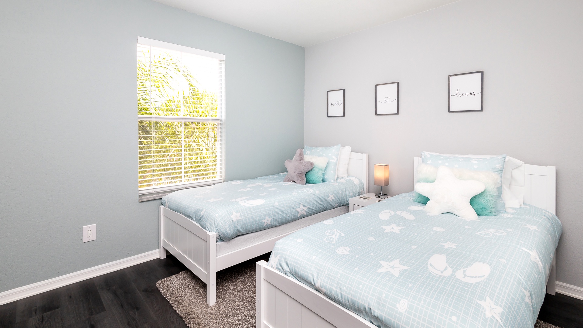 The final bedroom features a pair of cozy twin beds & Smart TV