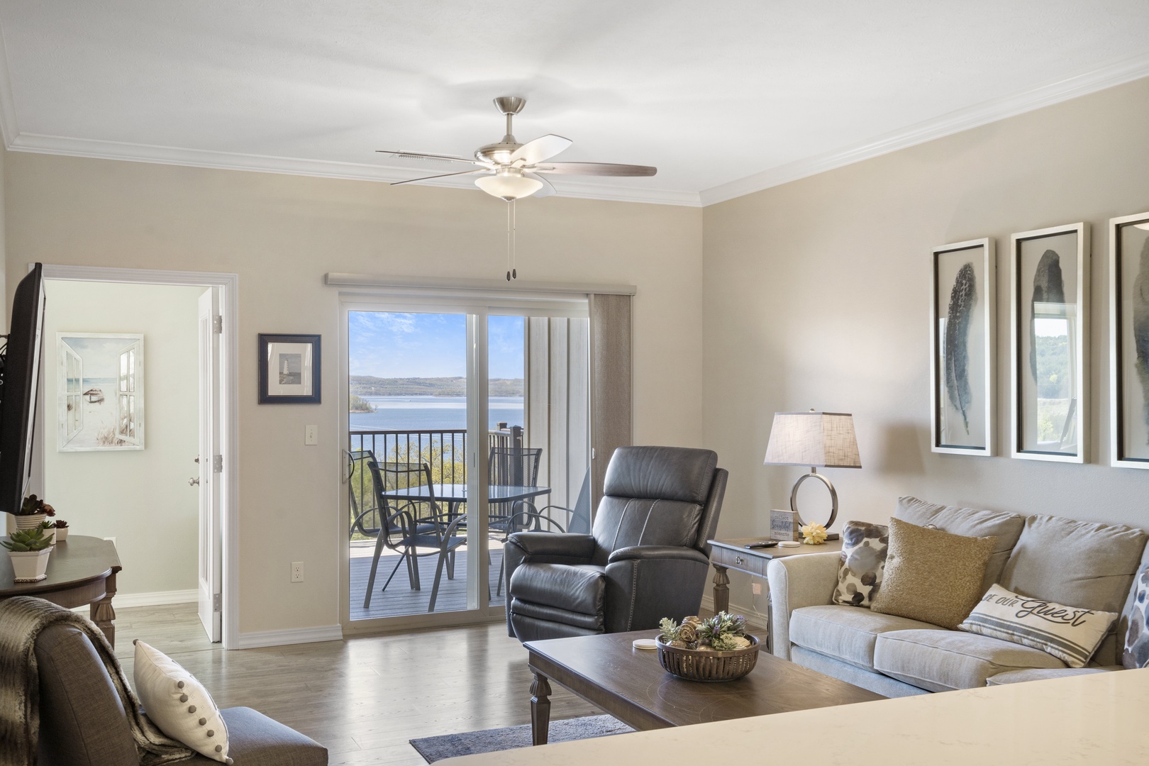 Open living space with Smart TV, sofa sleeper, balcony & sunroom access