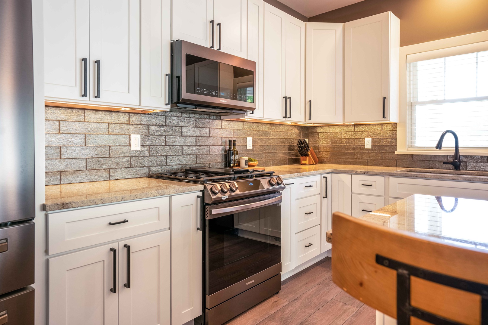 The open, airy kitchen offers ample space & all the comforts of home