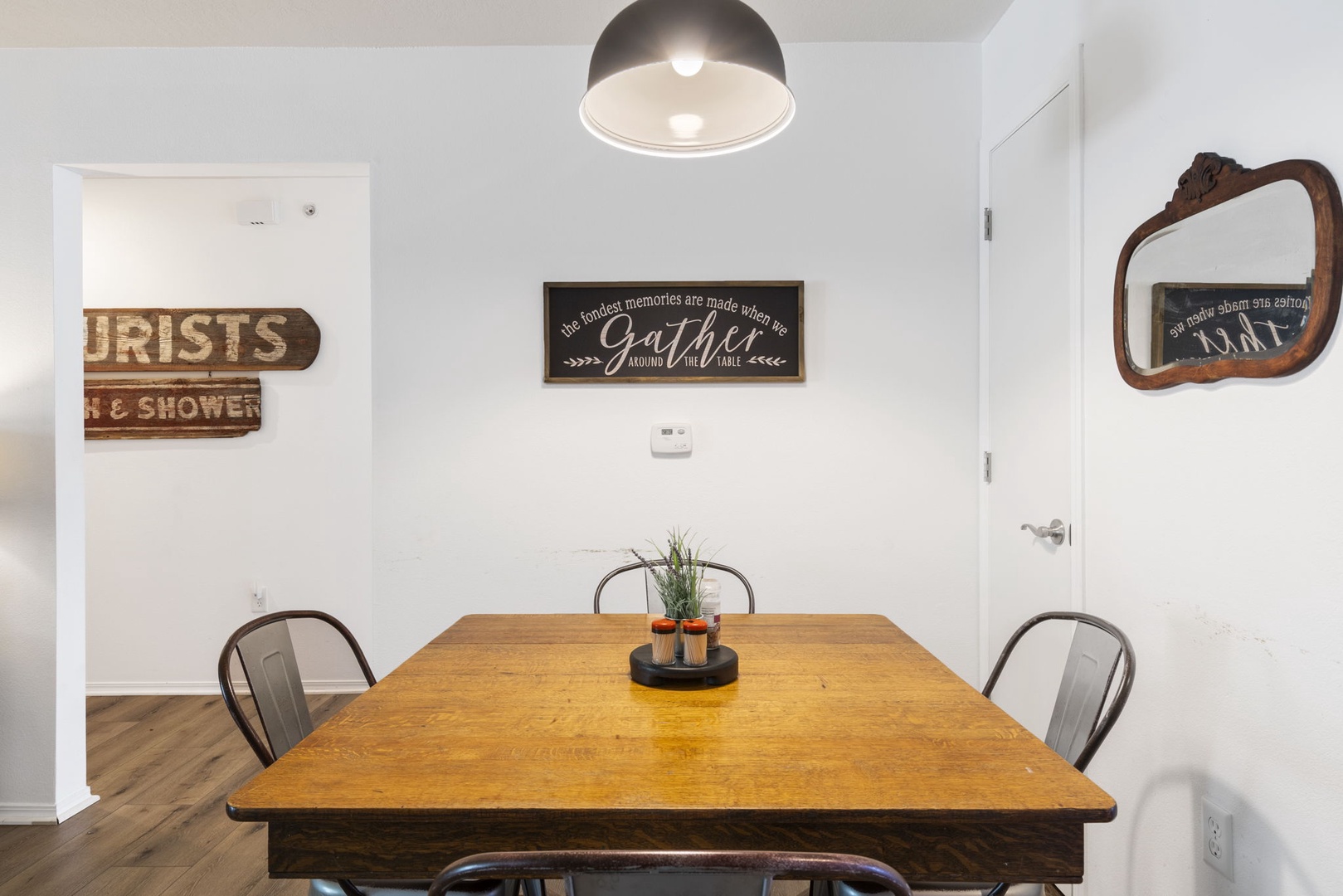 Gather around the rustic dining table, offering seating for 4