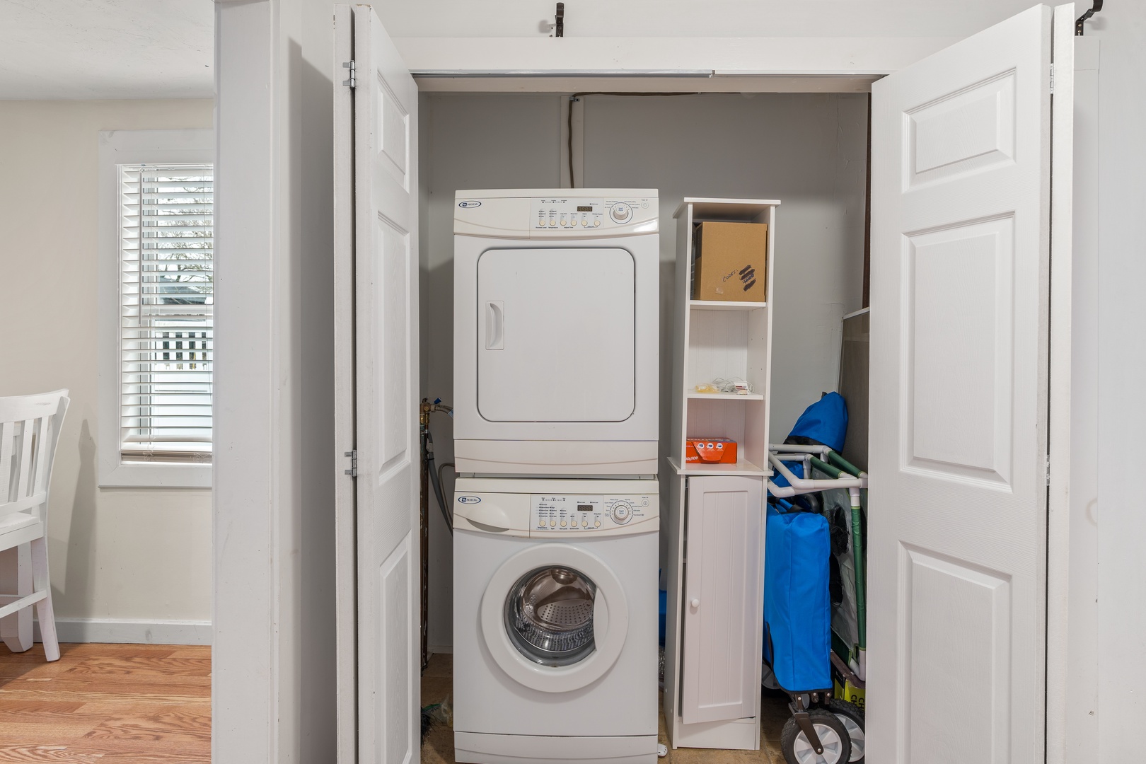 Private laundry is available for your stay, tucked away near the kitchen