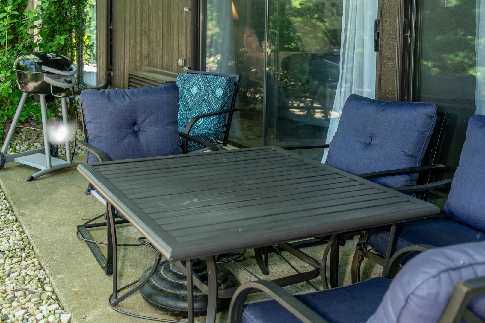 Patio with outdoor seating and grill