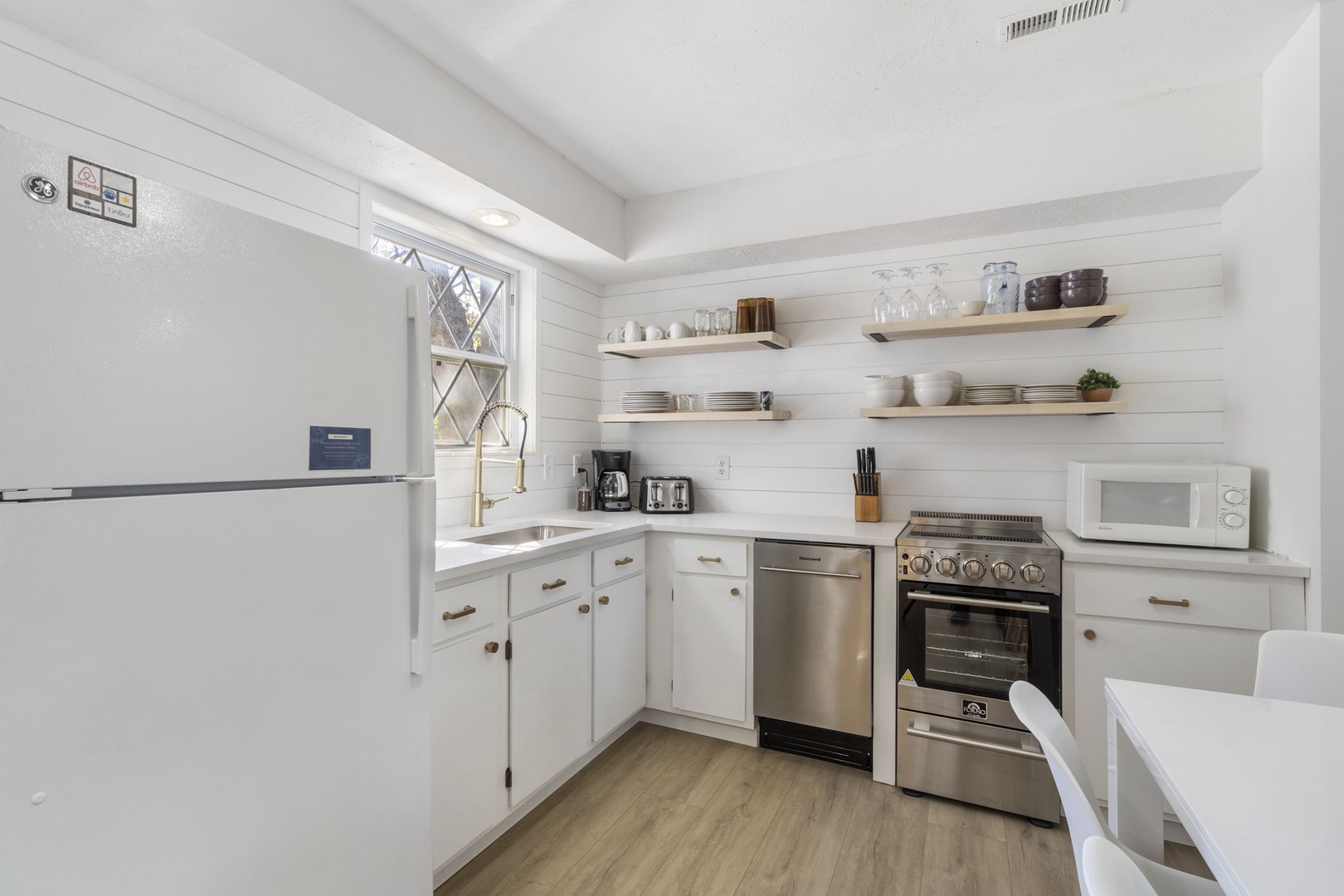 Unit 41: The bright, airy kitchen offers ample space & all the comforts of home
