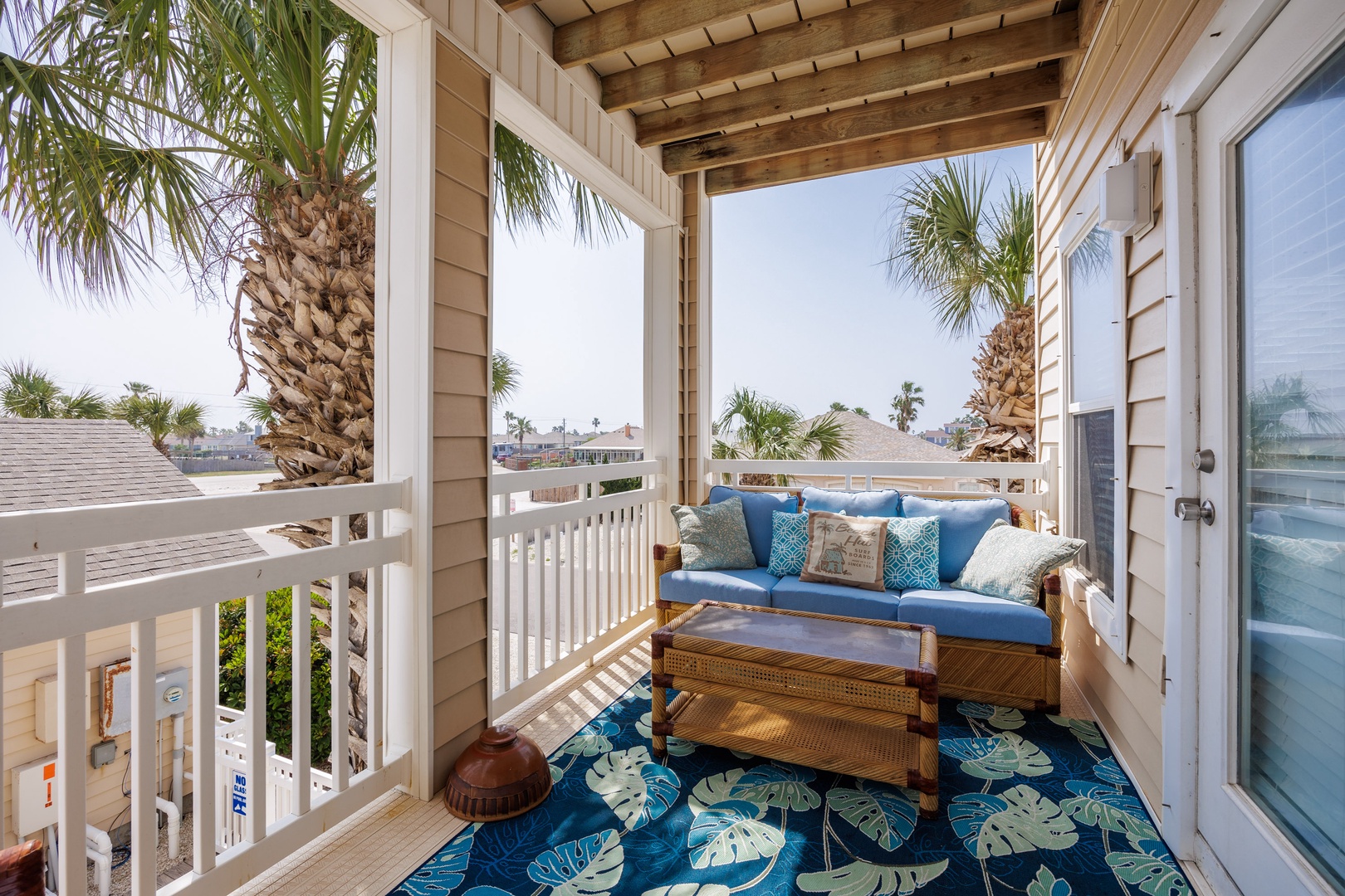 Take a breath of tranquility on the private balcony with pool view