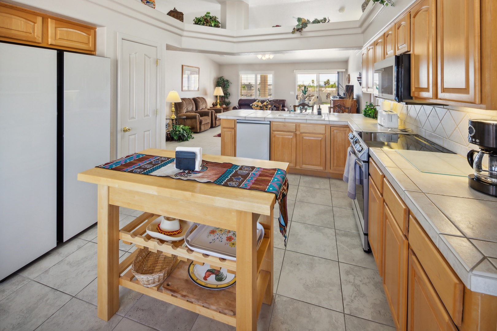 The open, airy kitchen offers ample space & all the comforts of home