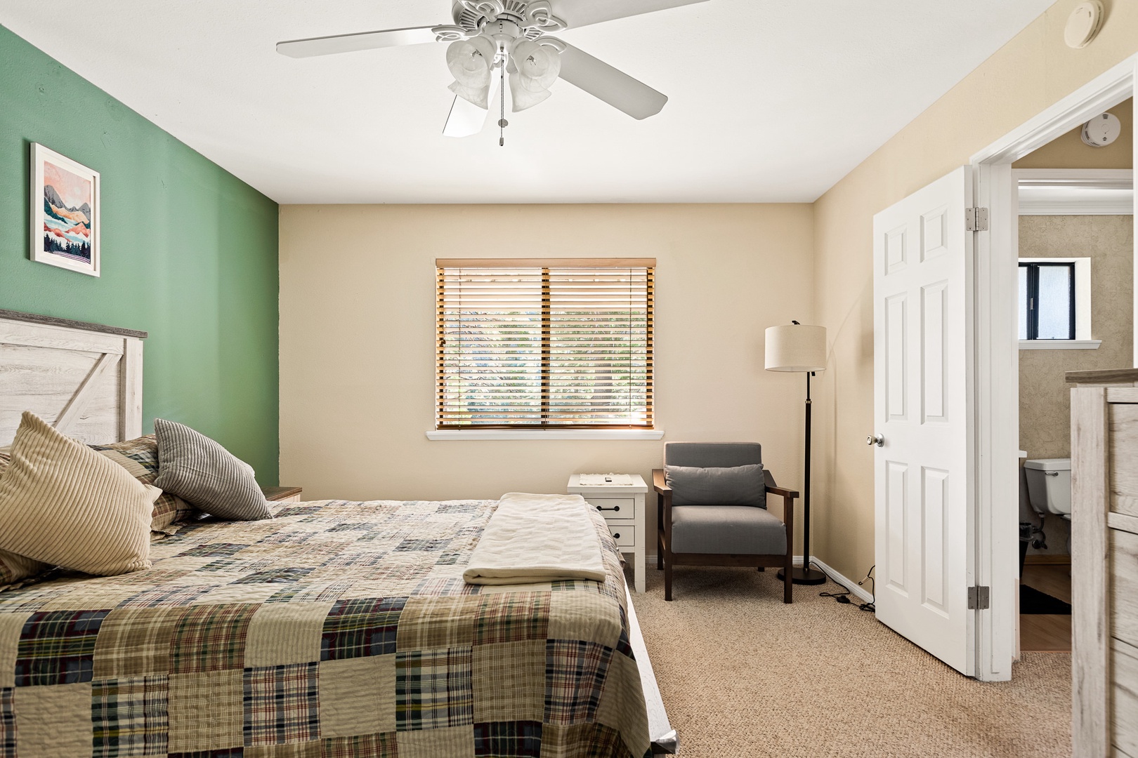 The 1st of two bedroom offers a queen bed, ceiling fan, & plenty of space