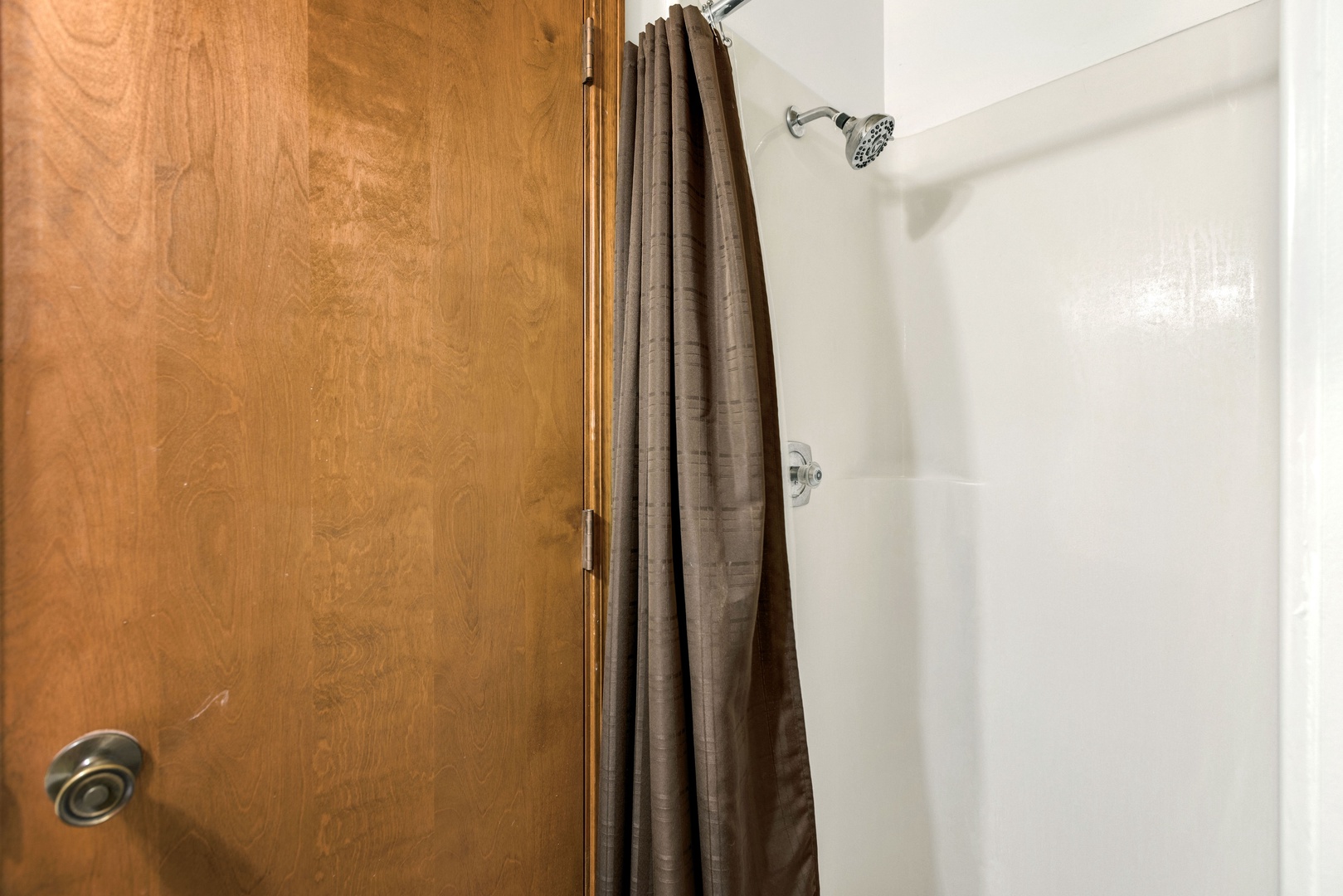 A single vanity & walk-in shower await in the loft’s full bathroom