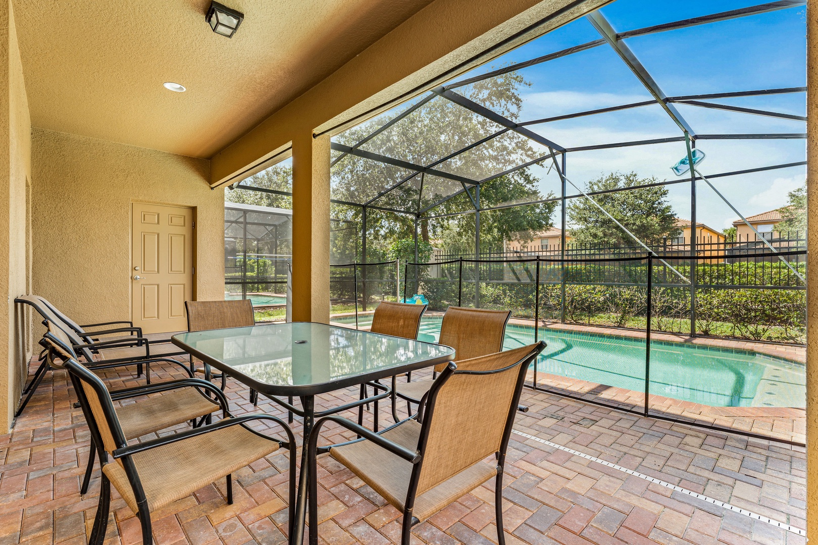 Screened in pool with outdoor seating