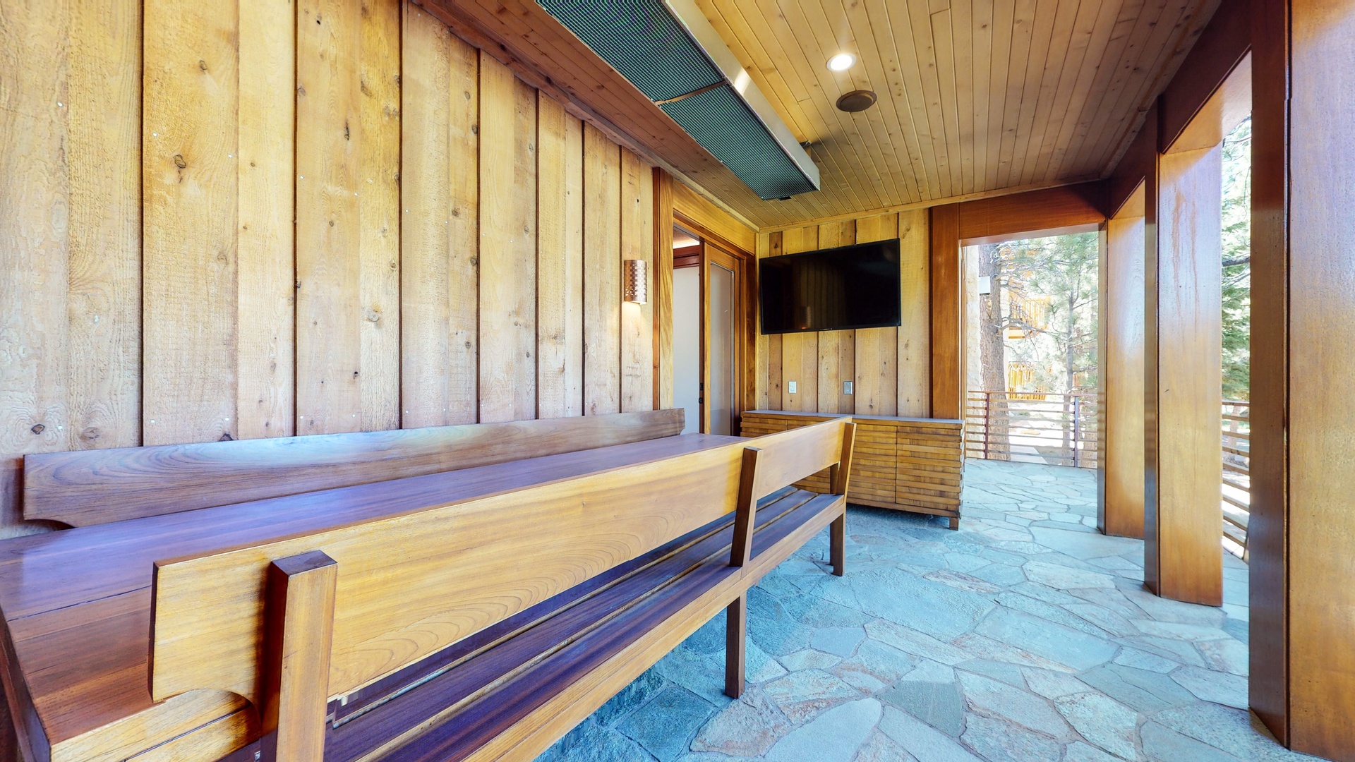 Wood table, and TV on 2nd floor deck