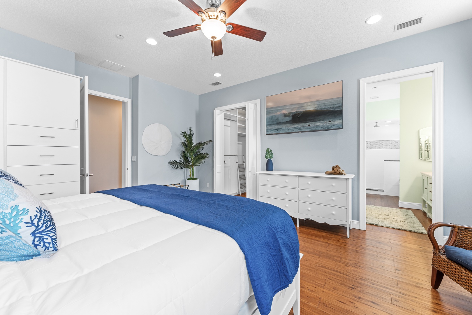 Bedroom 1 with king bed, TV, and ensuite