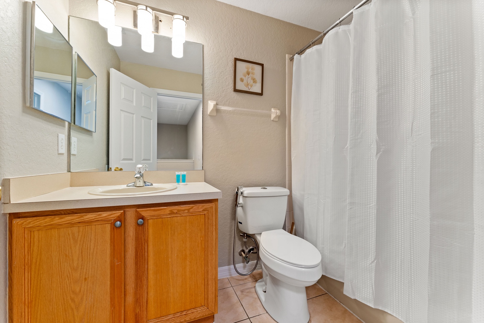 This 2nd floor hall bathroom includes a single vanity & shower/tub combo