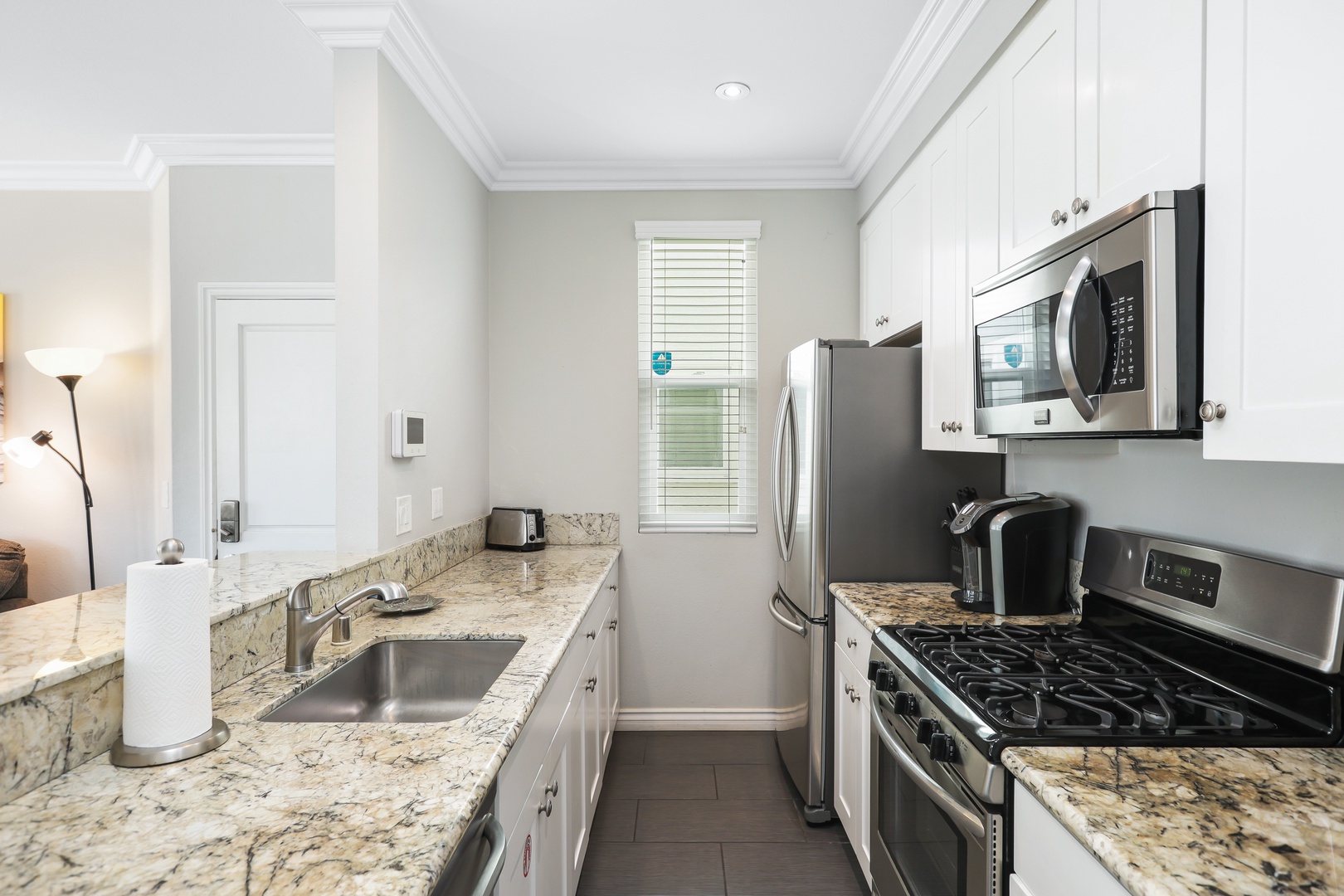 The open, airy kitchen offers ample space & every home comfort