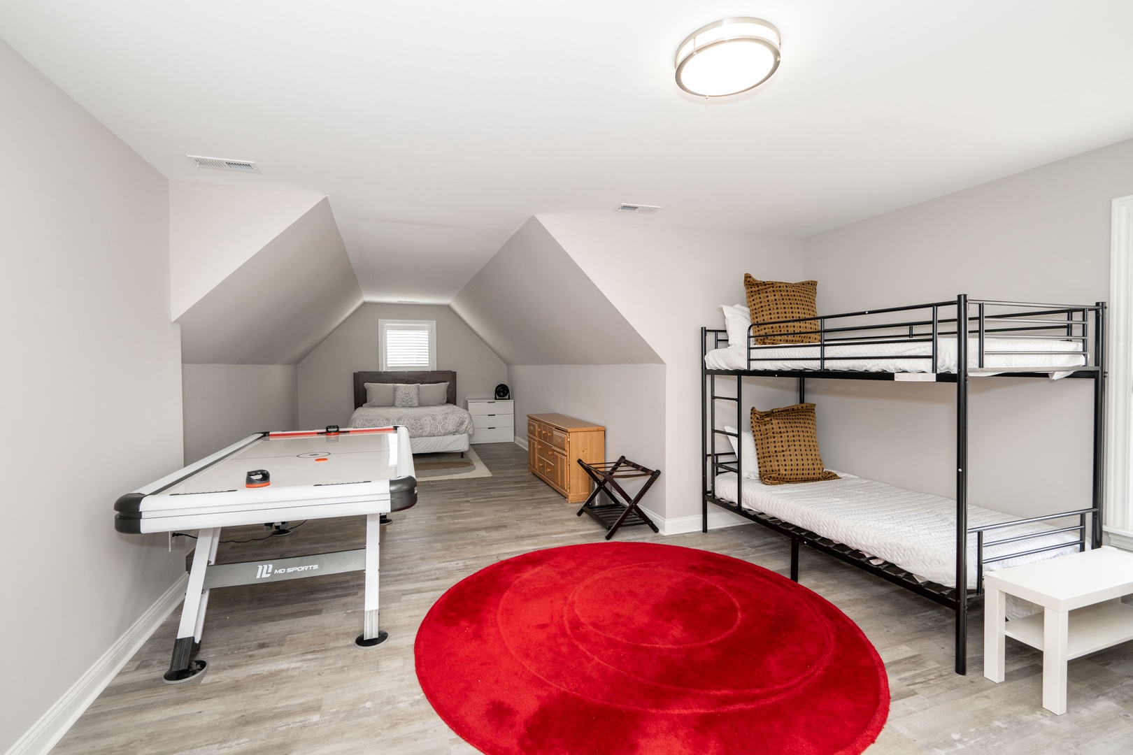 Bedroom 2 with Queen bed, Twin/Twin bunk bed, air hockey table, and en-suite