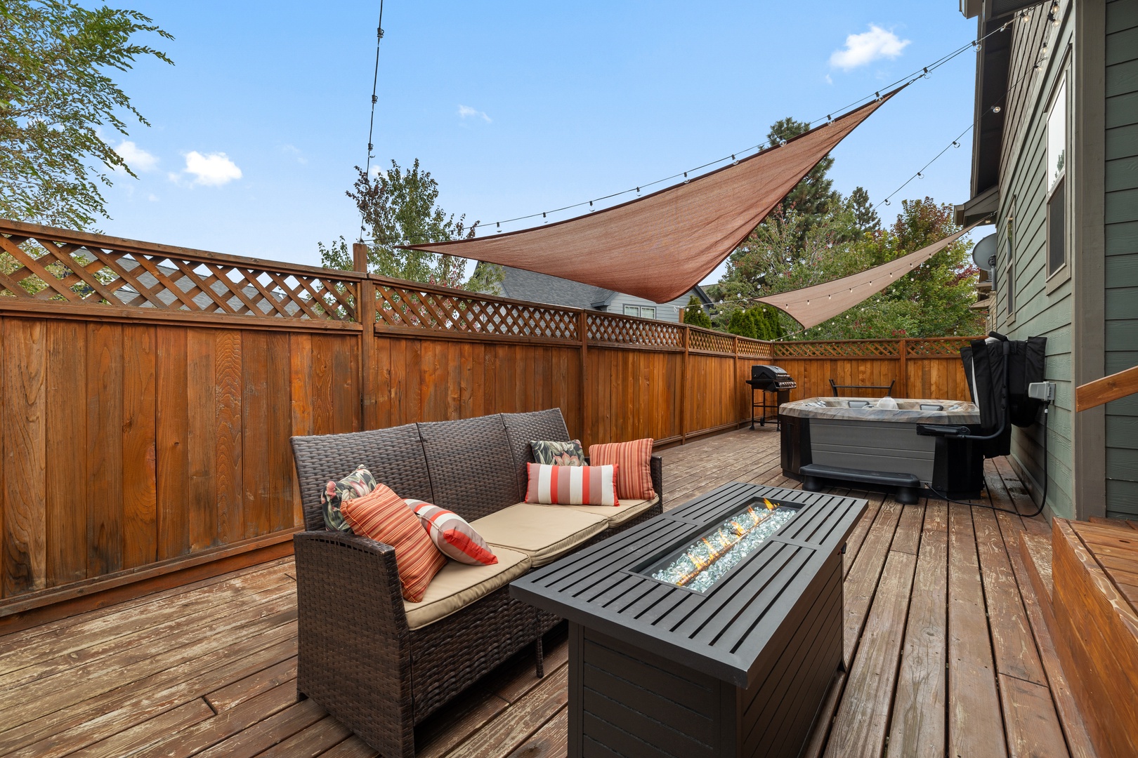 Unwind at the fire table on the back deck & make memories together
