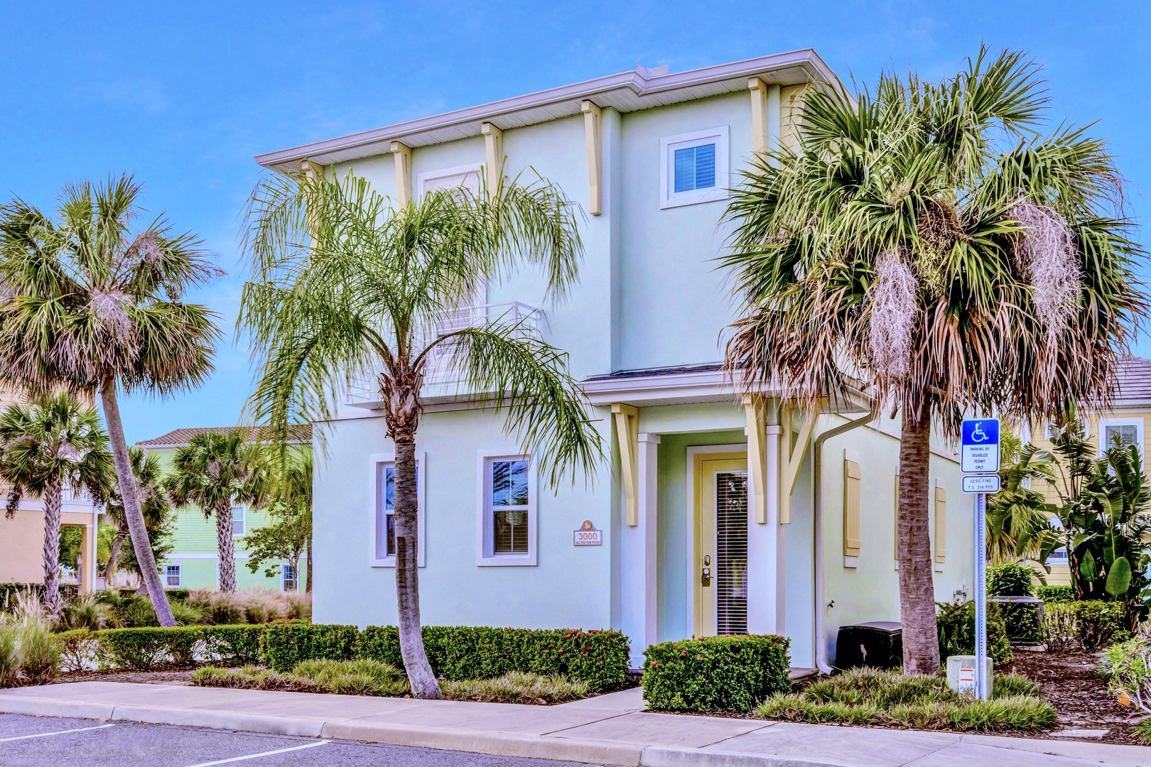A charming seafoam green cottage on a spacious corner lot in the vibrant Margaritaville Resort
