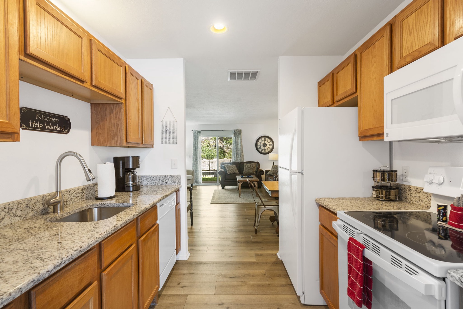 The airy kitchen offers wonderful amenities & ample storage space