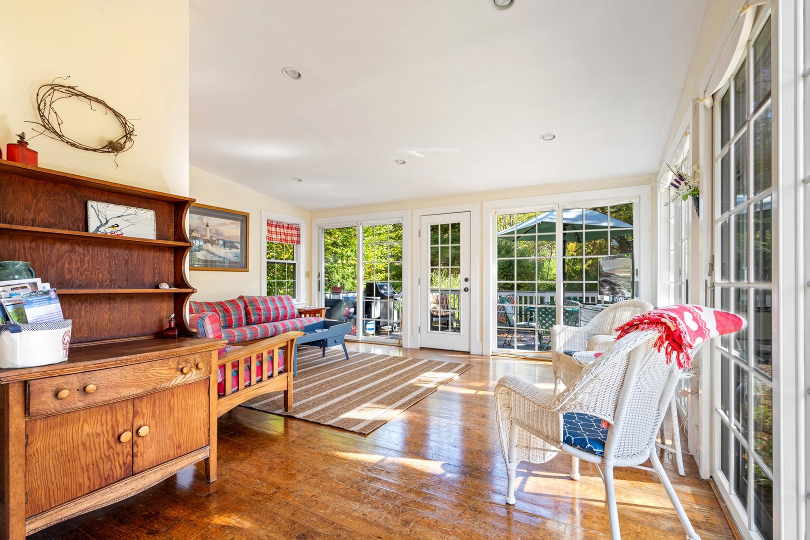 Bright living area with ample seating and Smart TV