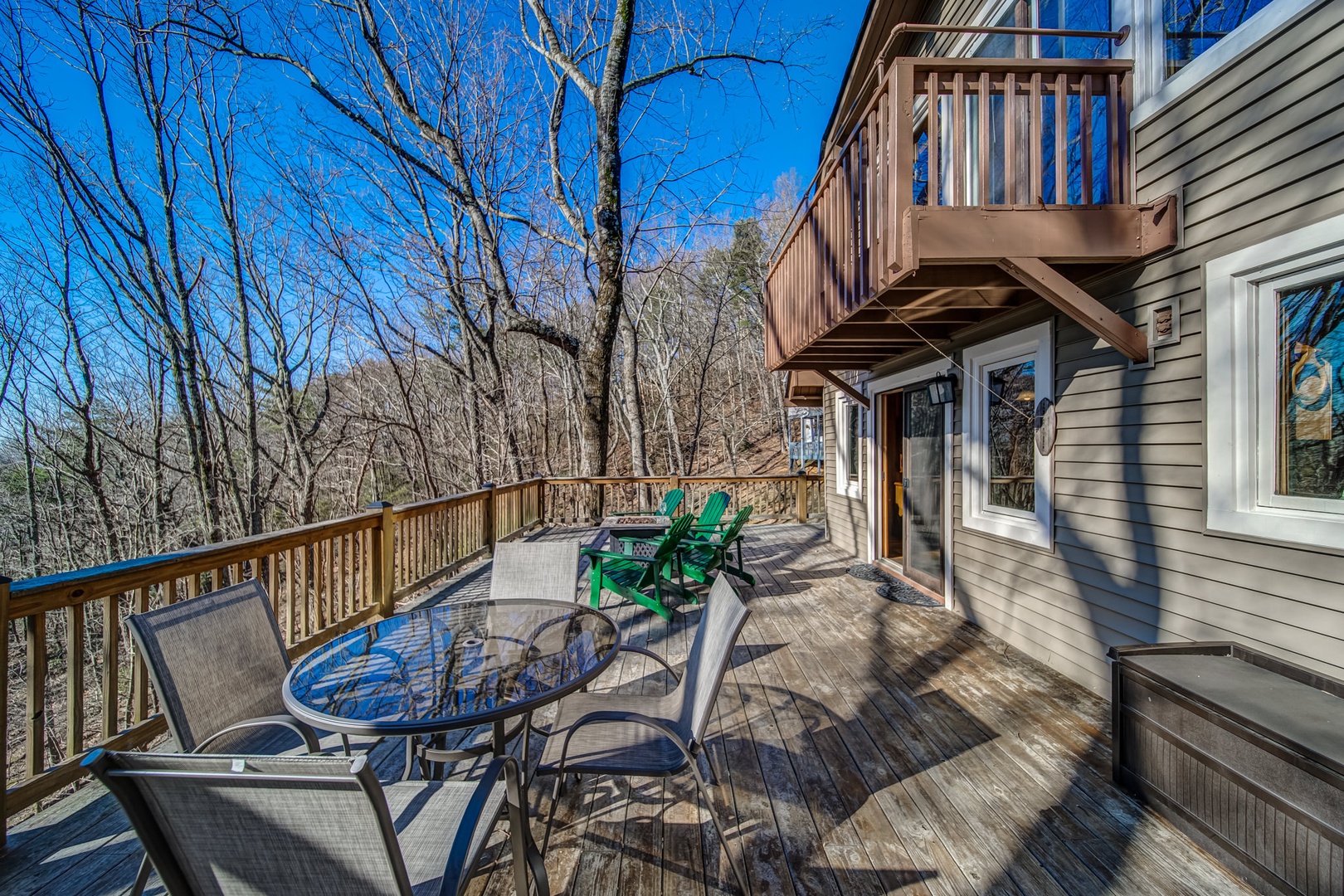 Ample outdoor seating on back deck