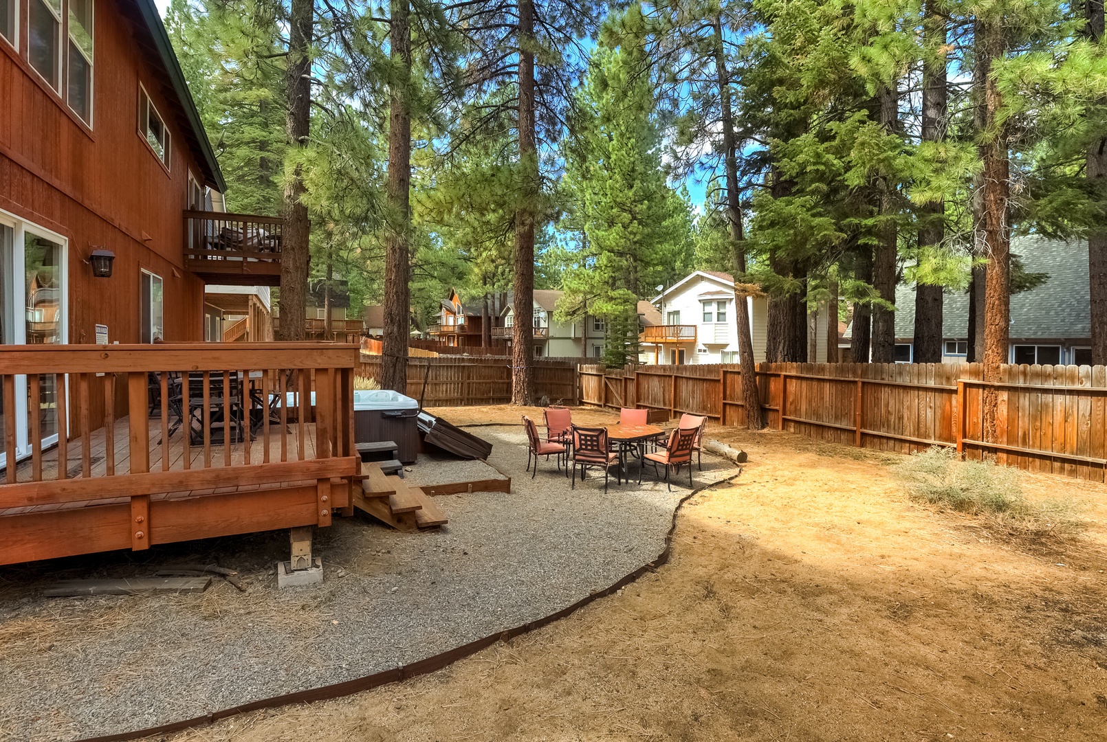 Backyard with private outdoor hot tub, BBQ, and patio seating