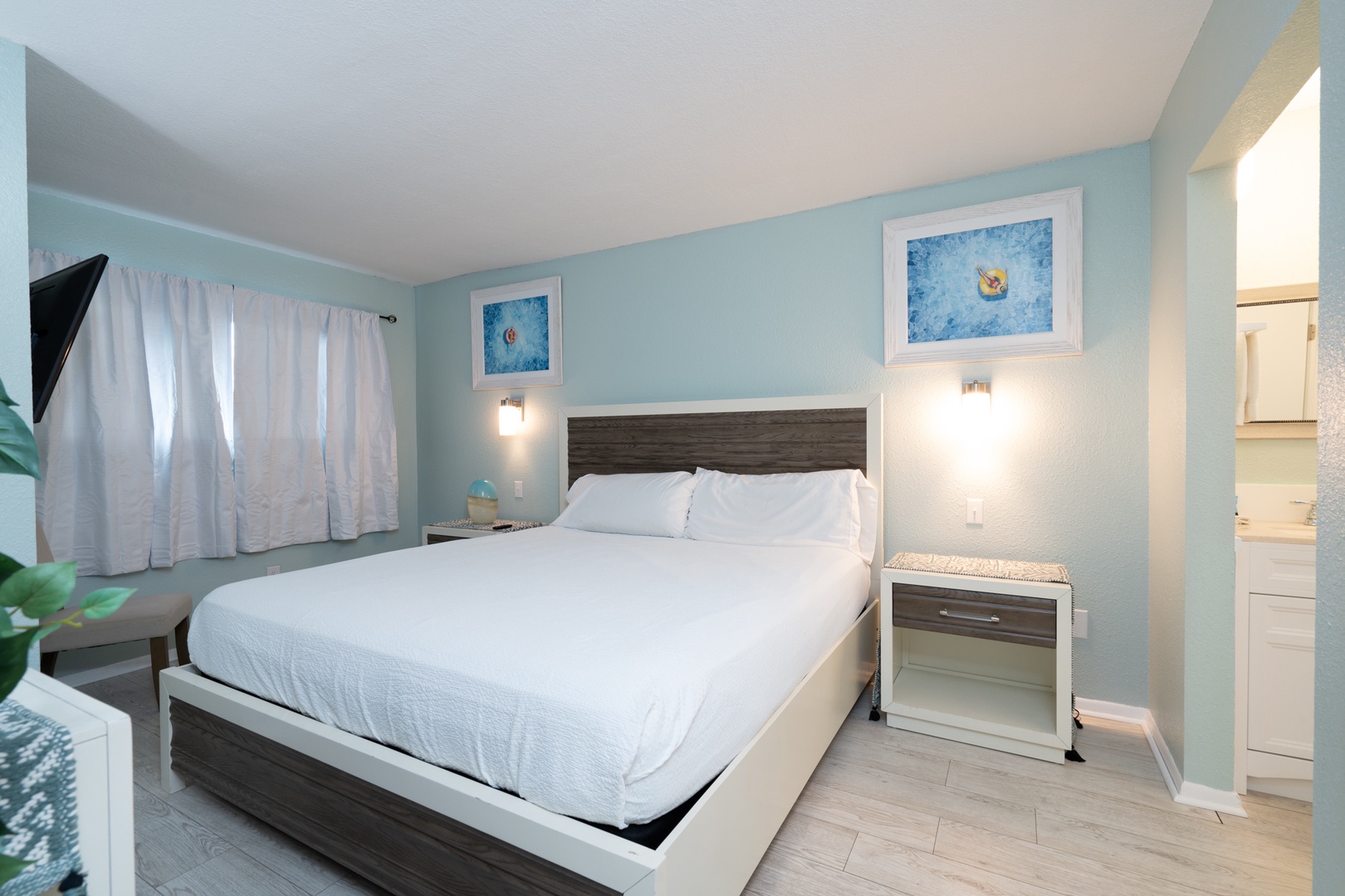 A plush king bed, ensuite bath, & smart TV await in the bedroom retreat